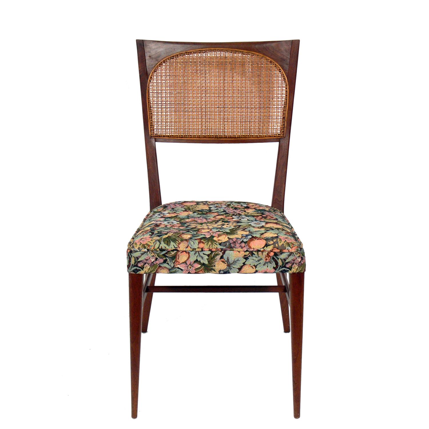 Set of eight Mid-Century Modern dining chairs, designed by Paul McCobb, American, circa 1950s. The set consists of one armchair and seven side chairs. Wood frames recently cleaned and oiled. The seats are currently being reupholstered and can be