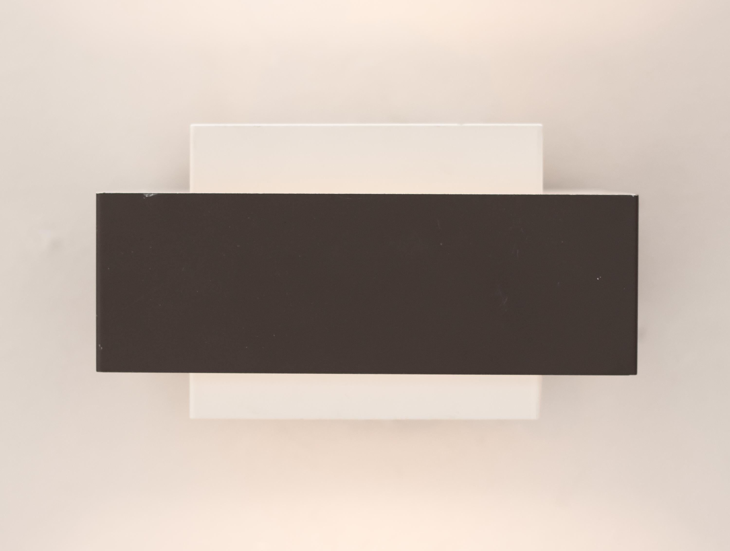 Minimalistic set of wall lights by Philips, made in grey and white enameled sheet metal. 
Marked with label, priced individually.
Free worldwide shipping.