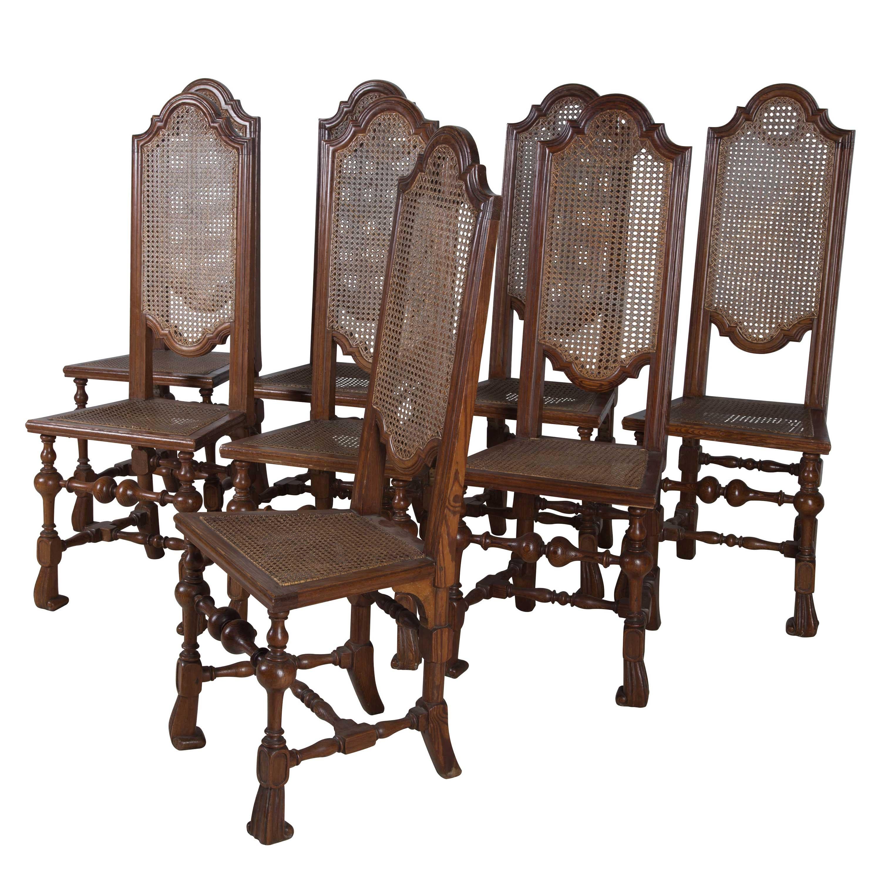 Two sets of eight pine 19th century dining chairs with cane seats. Priced per set of eight.
