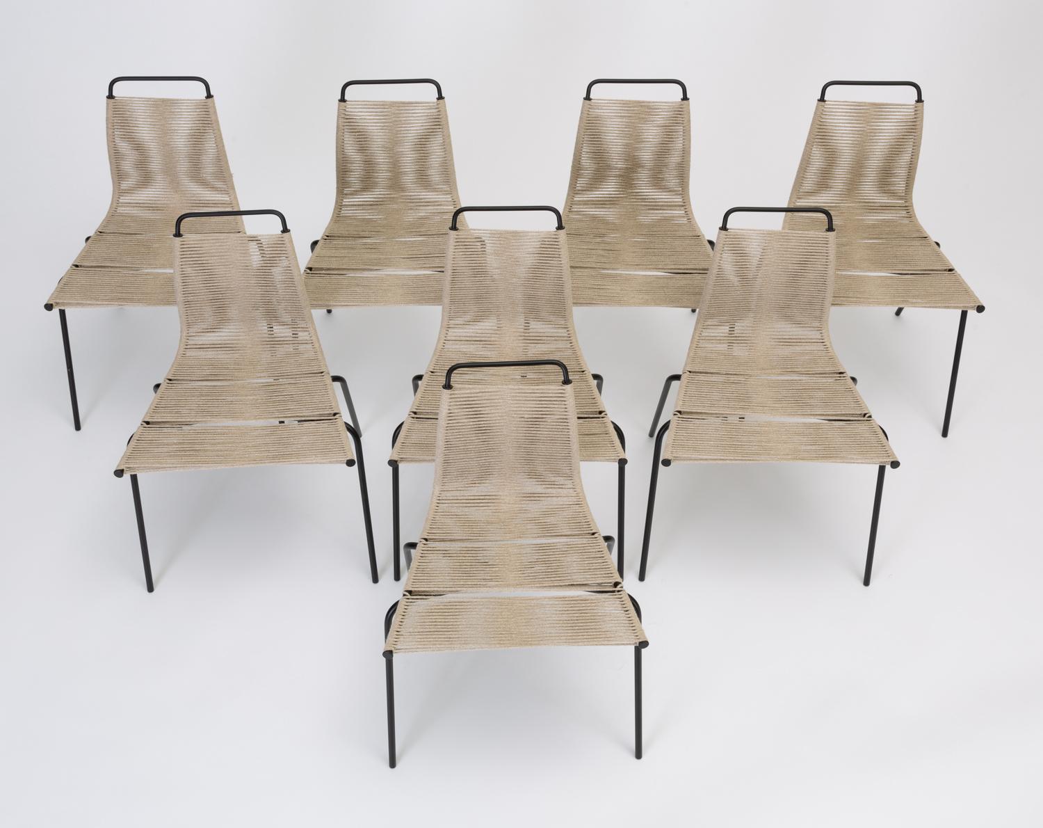 A set of eight dining chairs designed by Poul Kjærholm for E. Kold Christensen in 1955. Originally, the series PK-1, -2, and -3 referenced a complete line of steel-frame chairs with the seat material indicated by the model number (1 is done in