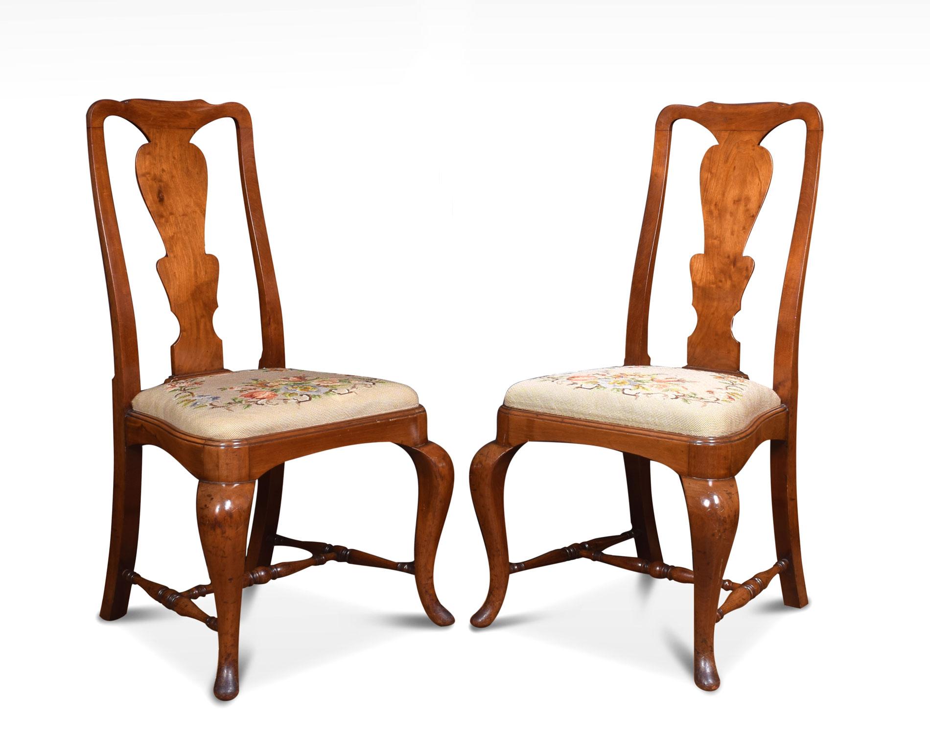 Set of eight Queen Anne style high back dining chairs, comprising of one armchair and seven chairs. having vase shaped back splat, drop-in seat and standing on cabriole supports united by turned stretchers.

Measures: Carvers
Height 40.5 inches