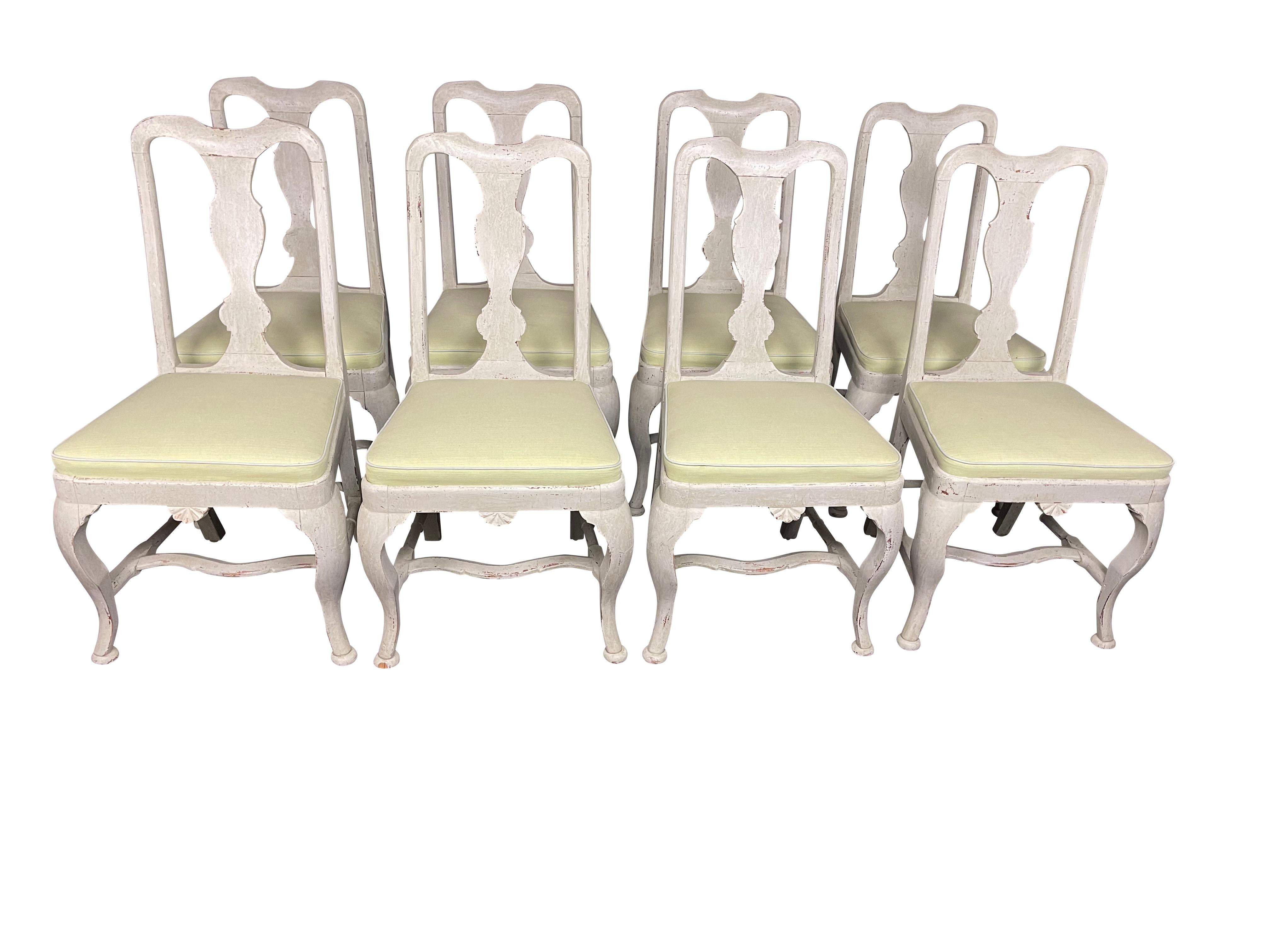 A very fine set of eight Swedish-style grey lime-washed dining chairs in the Queen Anne style with pierced splat backs, carved and shaped seat rail, refined cabriole legs, and H-stretcher. Well-proportioned chairs with restrained elegance. The