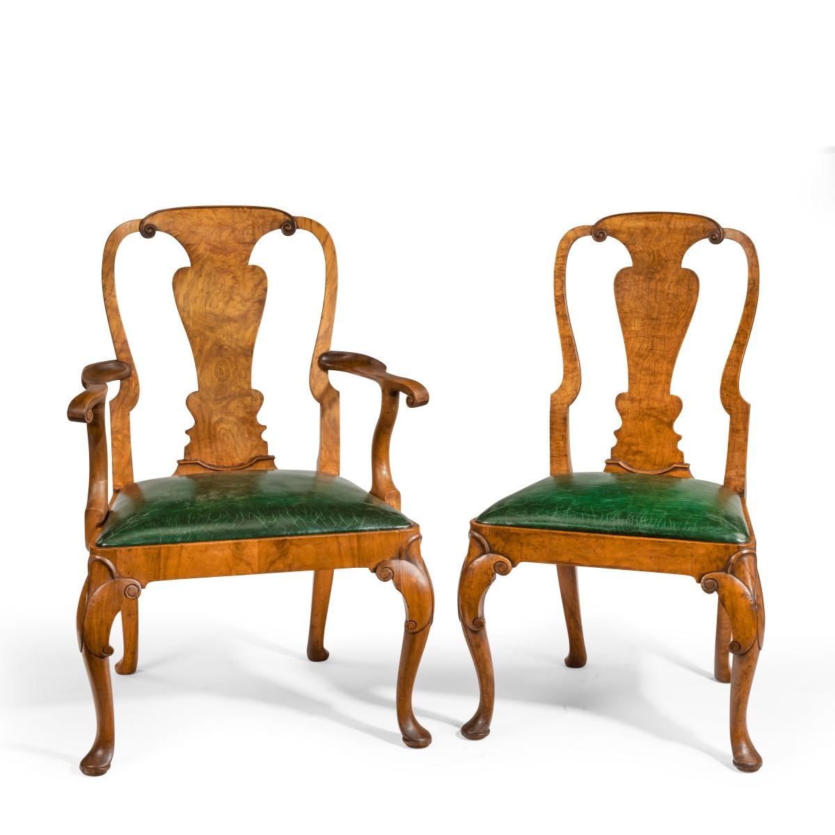 Fine set of eight Queen Anne style walnut and figured elm vase splat dining chairs, comprising two carvers and six side chairs, the backs with well-chosen figured elm splats above generous drop in seats, cabriole front legs, English, circa