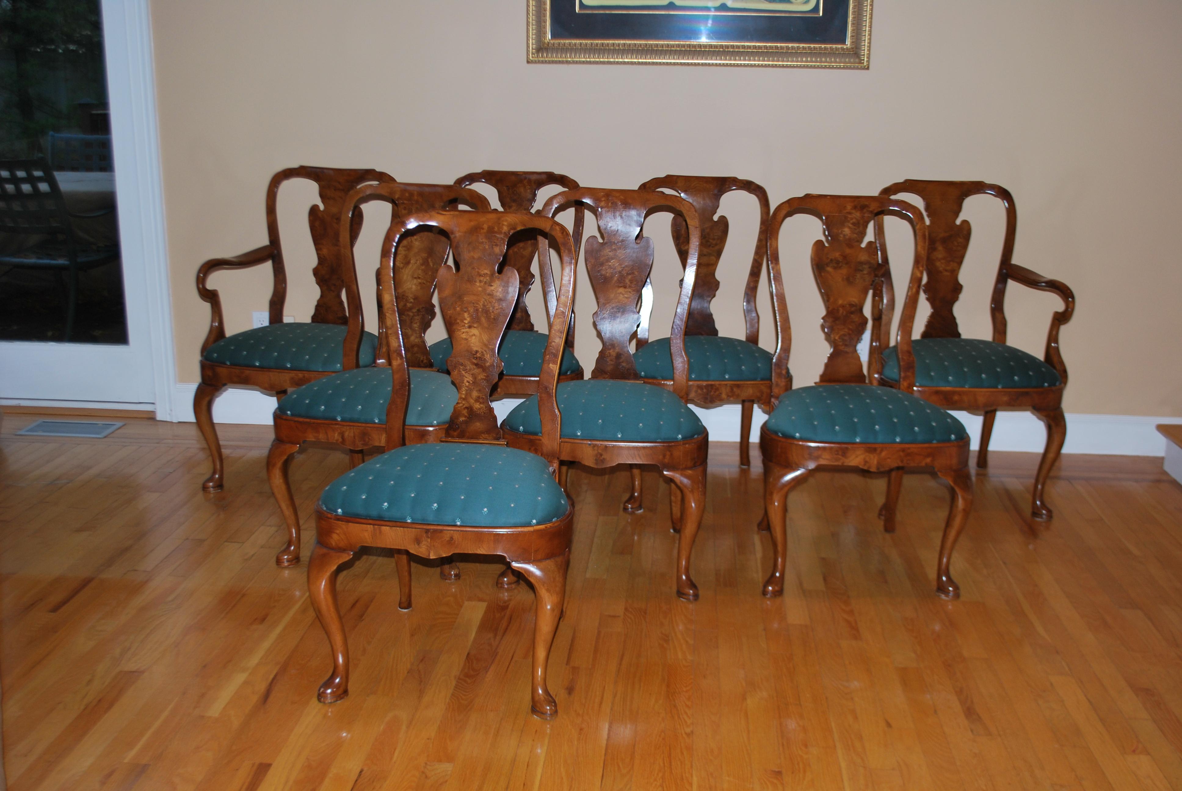 Set of eight Queen Anne style walnut dining chairs. A beautiful set made in walnut by Mill House Antiques, CT in 1992. 6 side chairs and 2 armchairs. Several chairs show slight separation on front where the wood was seamed and a small chip on one.