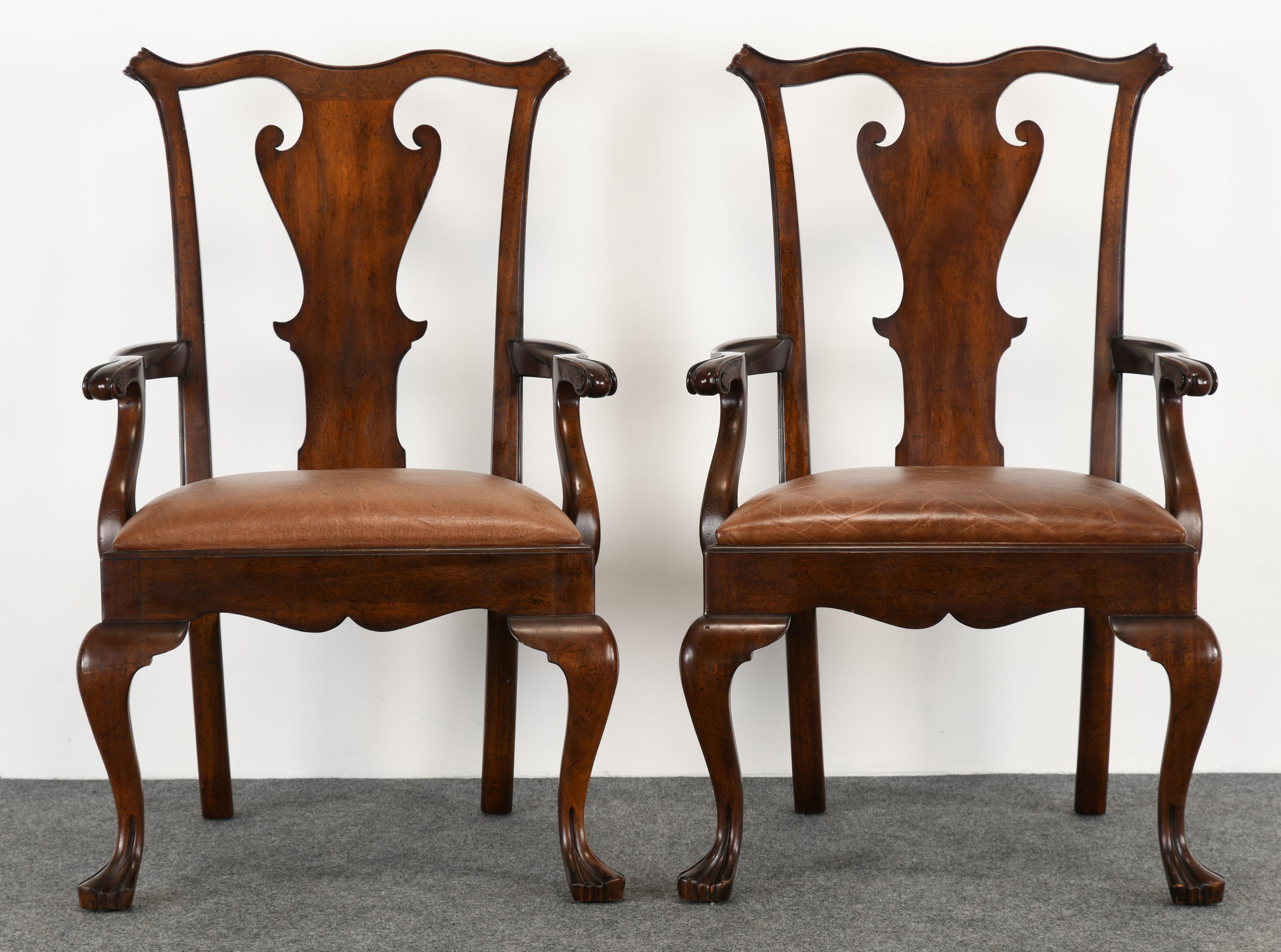 A fabulous set of eight Ralph Lauren Queen Anne-style dining chairs. This set consists of six side chairs and two armchairs. Each chair is beautifully made with substantial scale. These solid mahogany chairs with distressed leather seats would look