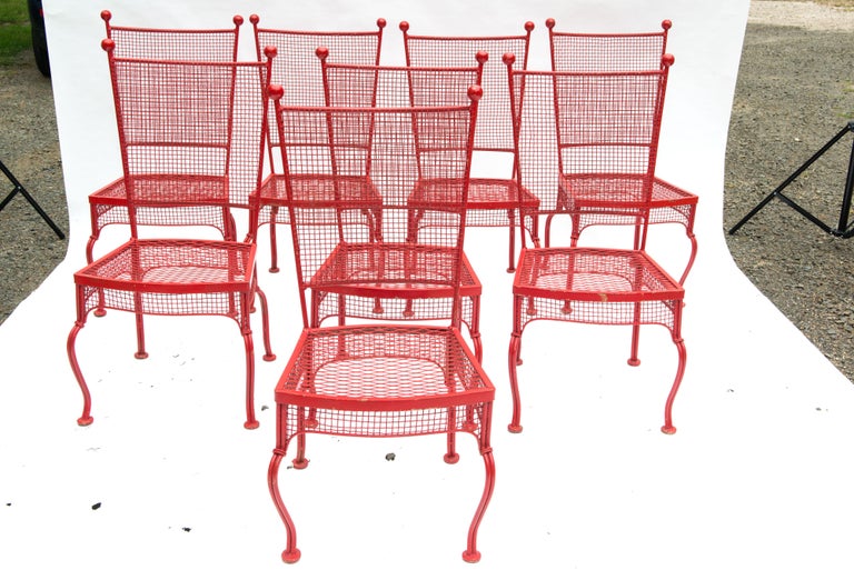 Spectacular and timeless Mid-Century Modern Russell Woodard wrought iron dining chairs in original red paint. Mesh seat, woven mesh back, ball finials.
Substantial and comfortable chairs. Rare.