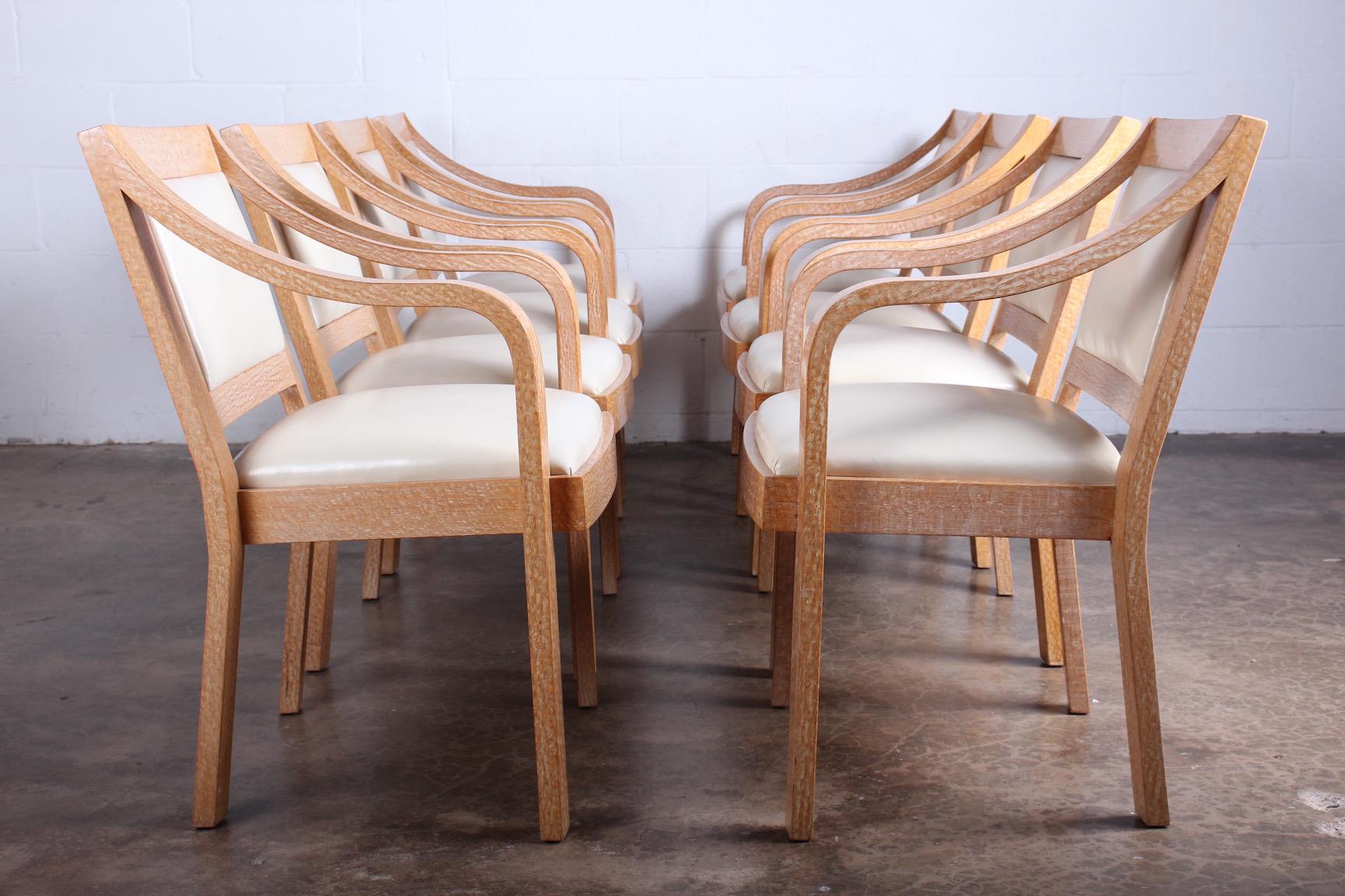 A set of eight regency armchairs in lacewood with original leather designed by Karl Springer for a Steven Chase interior.