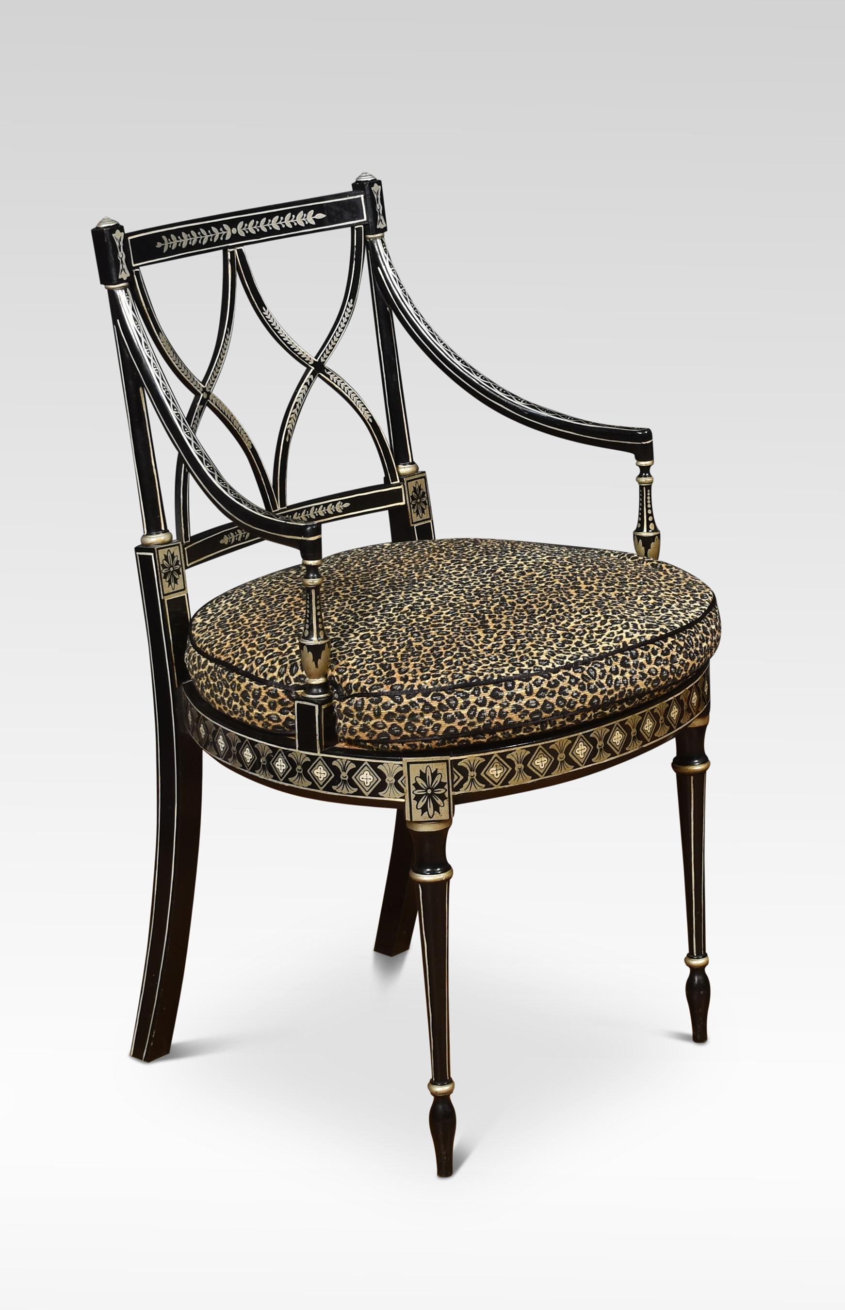 A set of eight Regency-style dining chairs with painted decoration on an ebonized ground. Above the berger seats having removable leopard skin print upholstered squab cushions enclosed by outswept arms. All raised up on turned tapering front