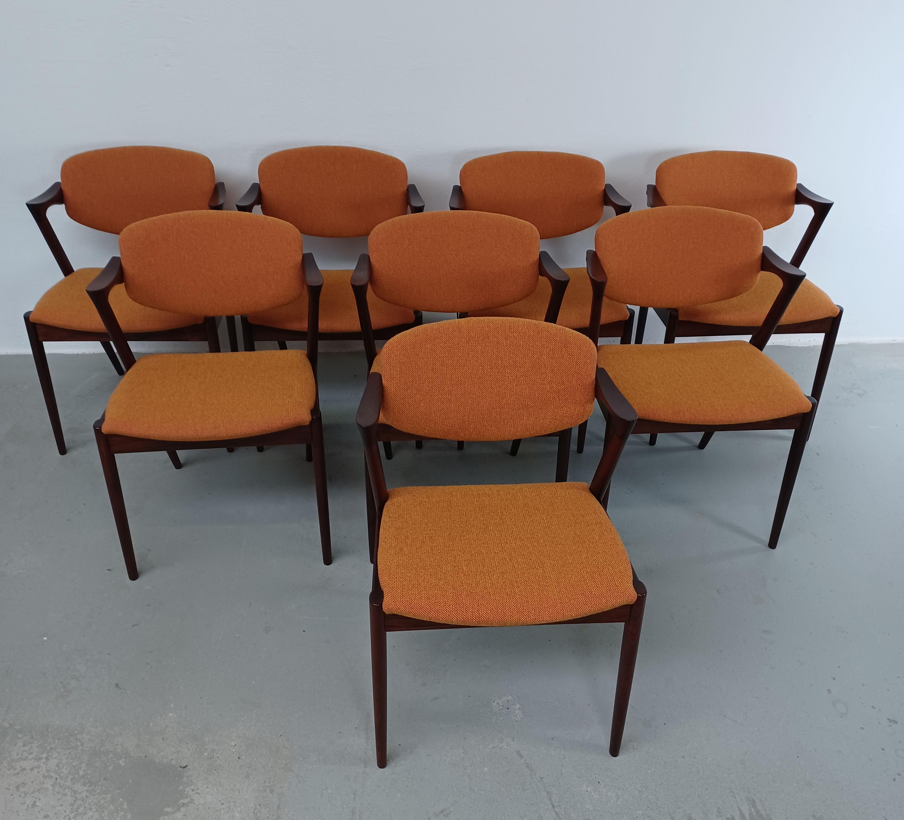 Set of eight fully restored, 1960s rosewood dining chairs by Kai Kristiansen for Schous Møbelfabrik with custom upholstery.

The chairs have Kai Kristiansens typical light and elegant design that make them fit in easily where you want them in your