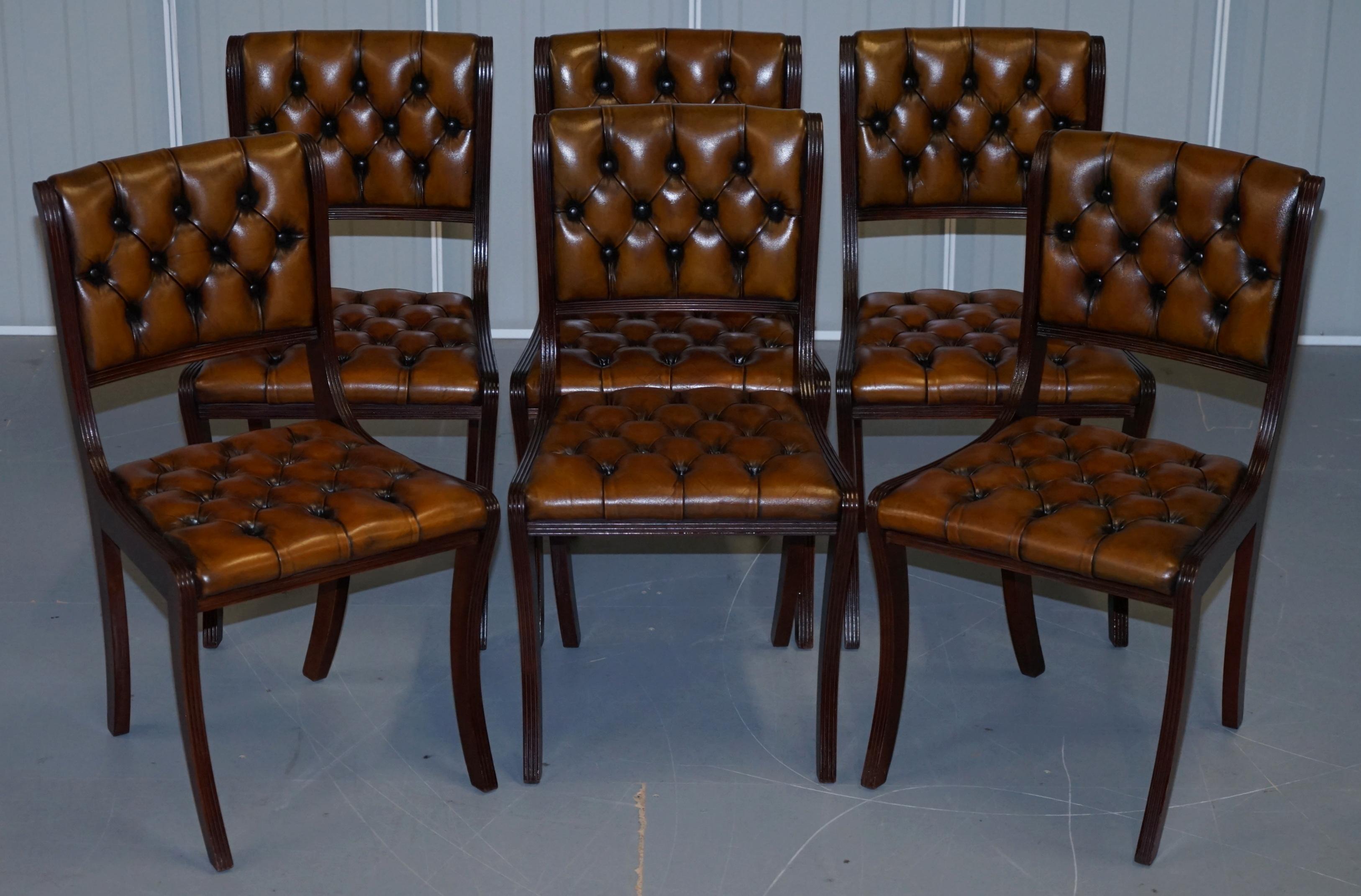 We are delighted to offer for sale this stunning set of eight Vintage fully restored Chesterfield aged cigar brown leather dining chairs

A very good looking and well made suite, the frames are all mahogany, they have reeded frames running down