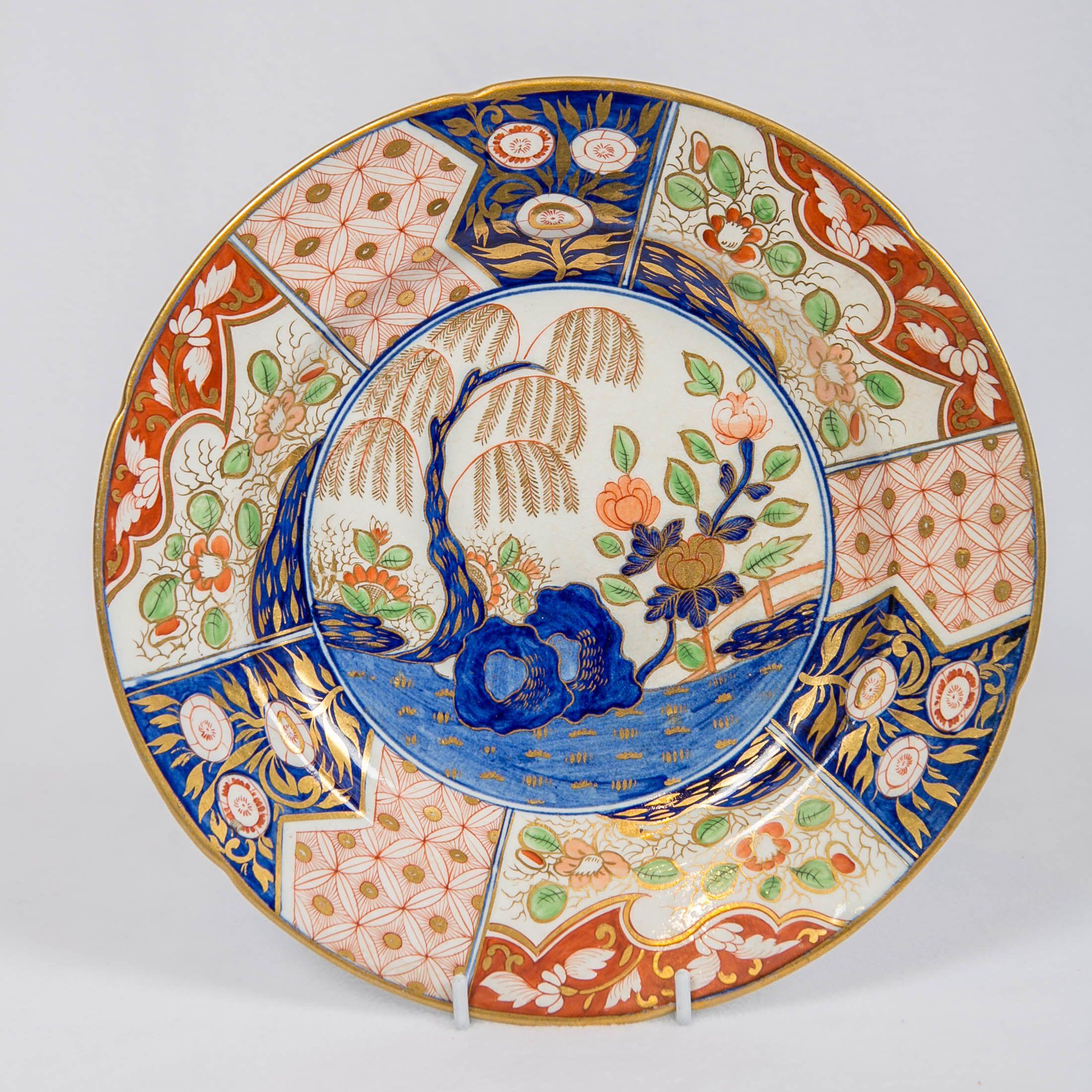 Why we love it: The color combinations are magnificent.
We are proud to offer this set of eight Coalport Rock and Tree pattern soup plates. They were hand-painted in England, circa 1820. The pattern shows a fenced garden, peonies, and a willow tree