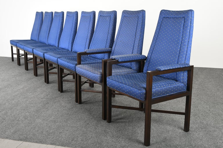 A sturdy set of eight Roger Sprunger for Dunbar dining chairs. The set of stylized chairs have high backs and X-bases to create a dramatic effect. These ebonized chairs are structurally sound and very beautifully constructed. The set of chairs are