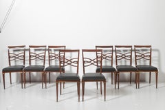 Set of Eight Rosewood Dining Chairs Covered in Vinyl with Brass Accents