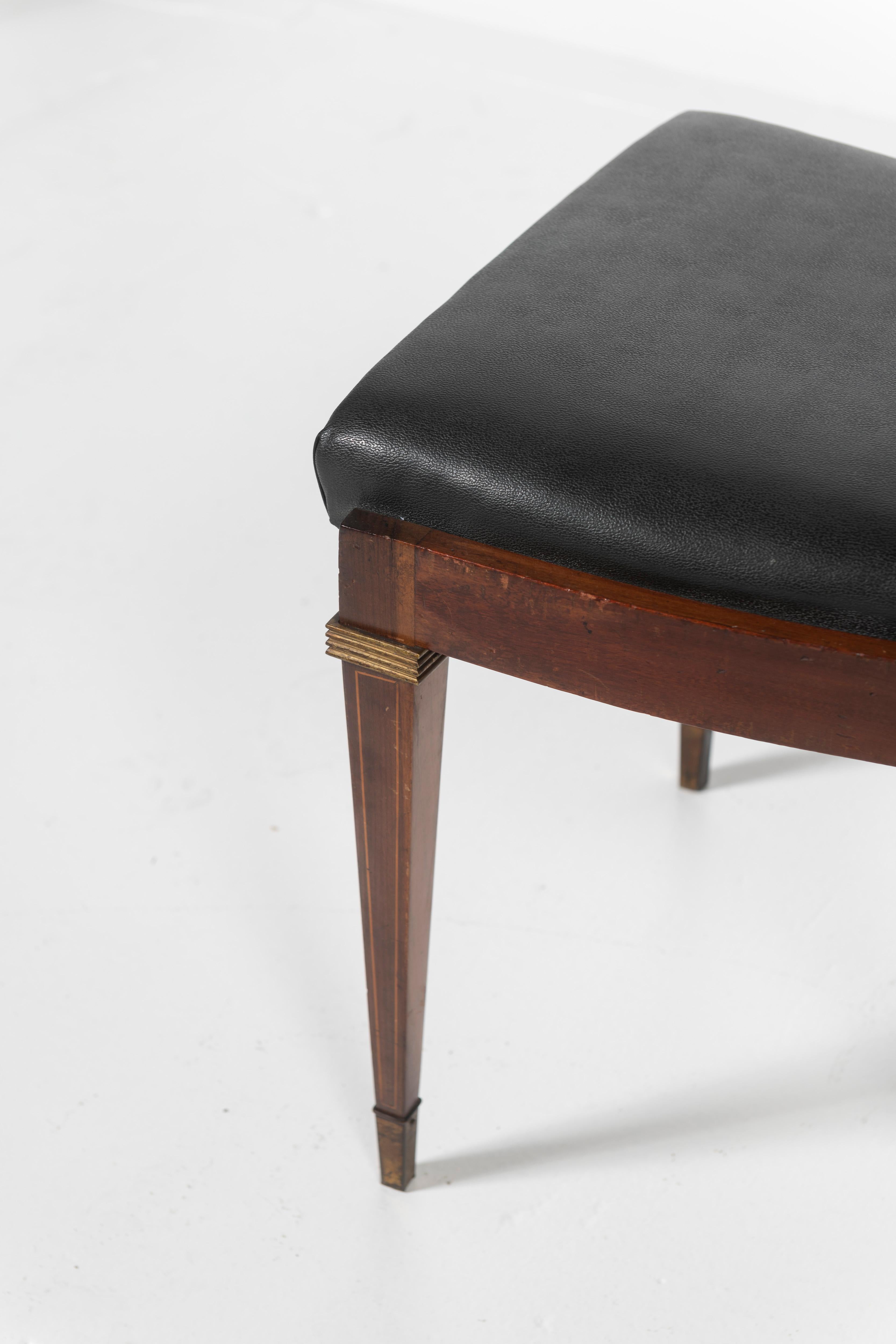 Mid-20th Century Set of Eight Rosewood Dining Chairs Covered in Vinyl with Brass Accents For Sale