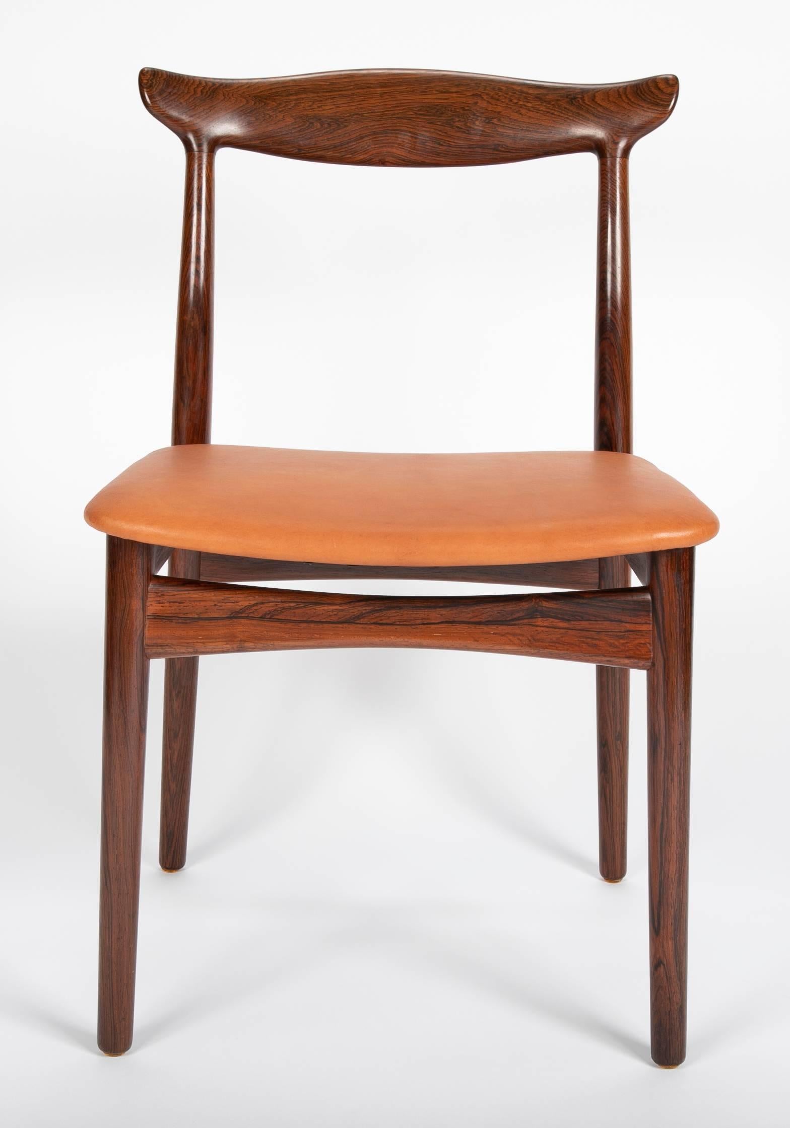 The set were produced by Vamo Sonderborg in Denmark, circa 1960. They are all covered in Cognac leather.