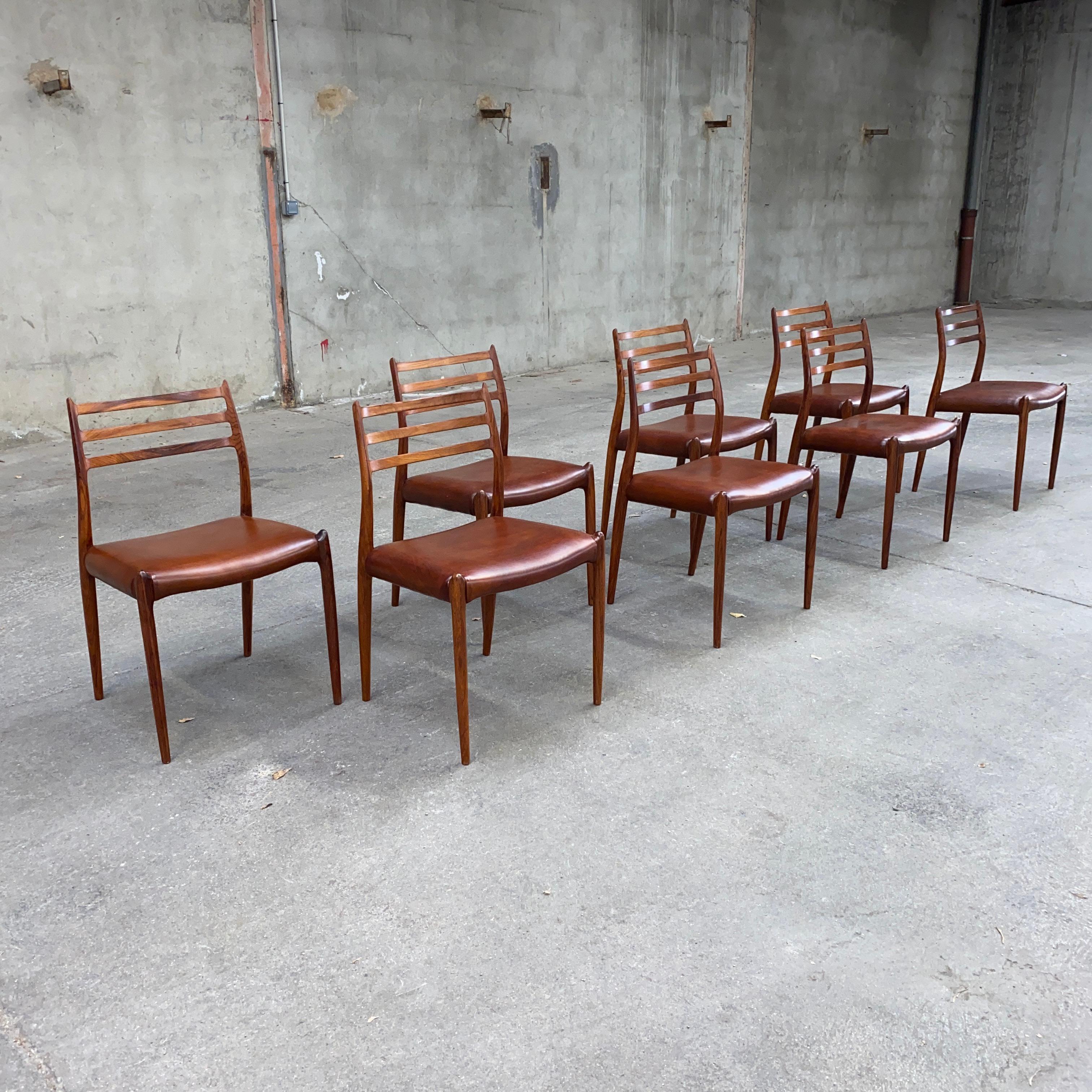 Mid-Century Modern Set of Eight Rosewood Dining Chairs Designed by Niels O. Moller for J.L. Moller