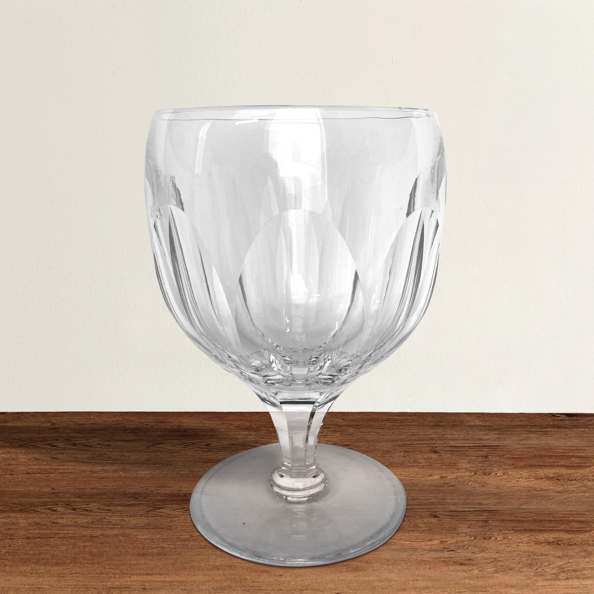 A striking set of eight English Webb 'Royal Yacht' crystal wine goblets. The Royal Yacht pattern was created in honor of the launch of HMY Britannia in 1954. The glasses were designed with a low, wide bowl, a wide foot, and quite a bit of heft to