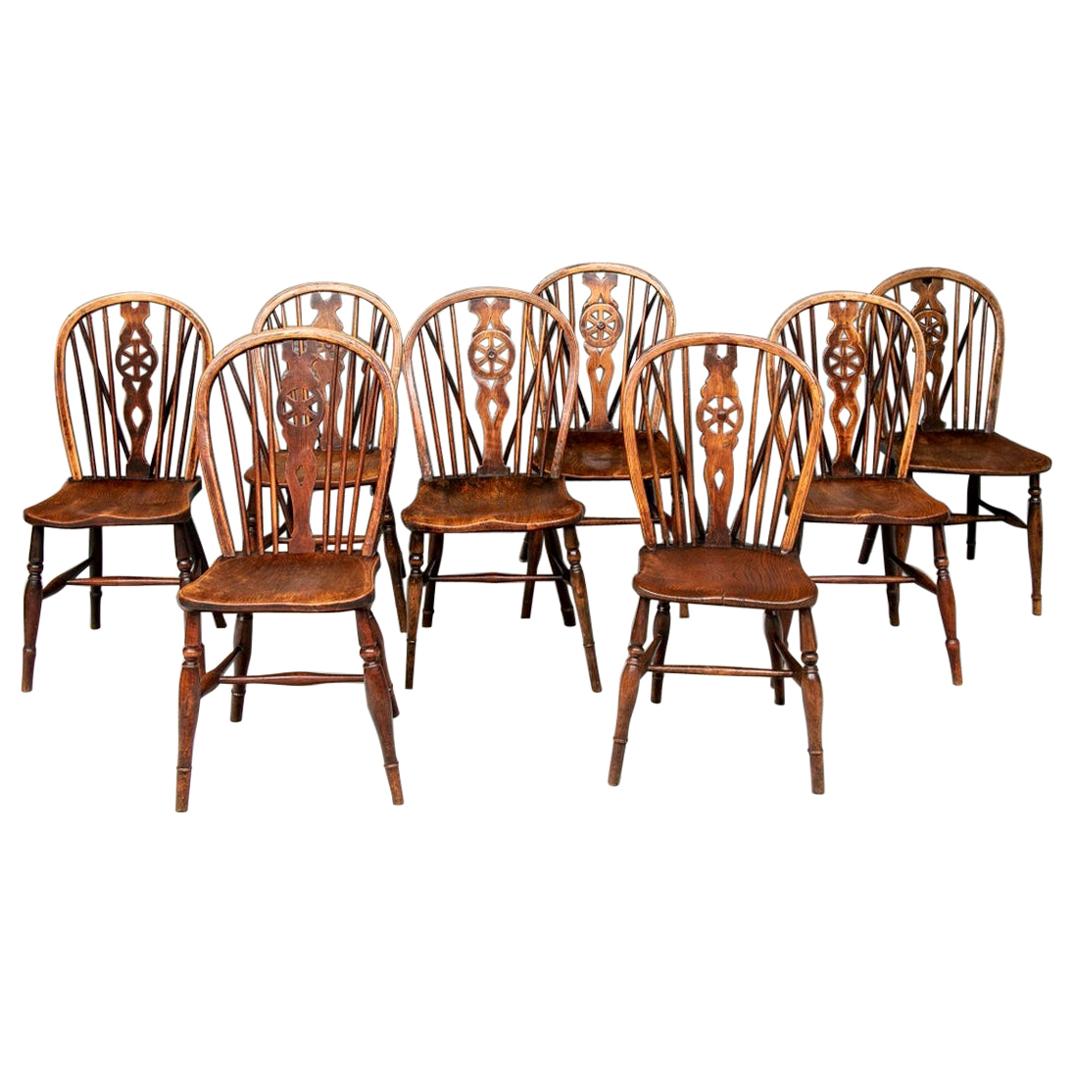 Set of Eight Semi-Antique Wheel Back Windsor Chairs