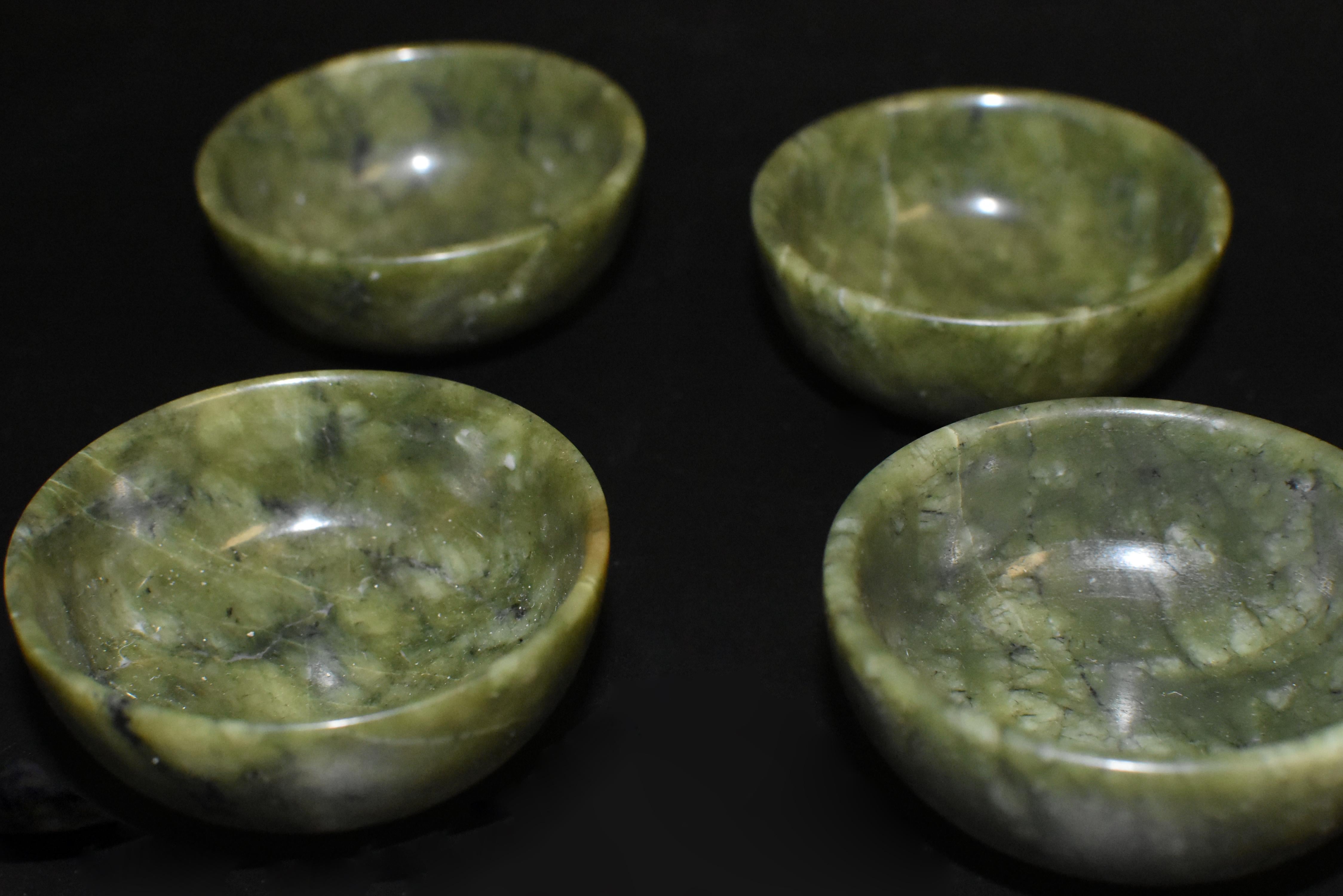 A set of eight beautiful natural gemstone serpentine bowls/cups. Inclusions are intriguing and unique, translucent under the light. Make wonderful displays, and are most elegant to serve tea in. 
 