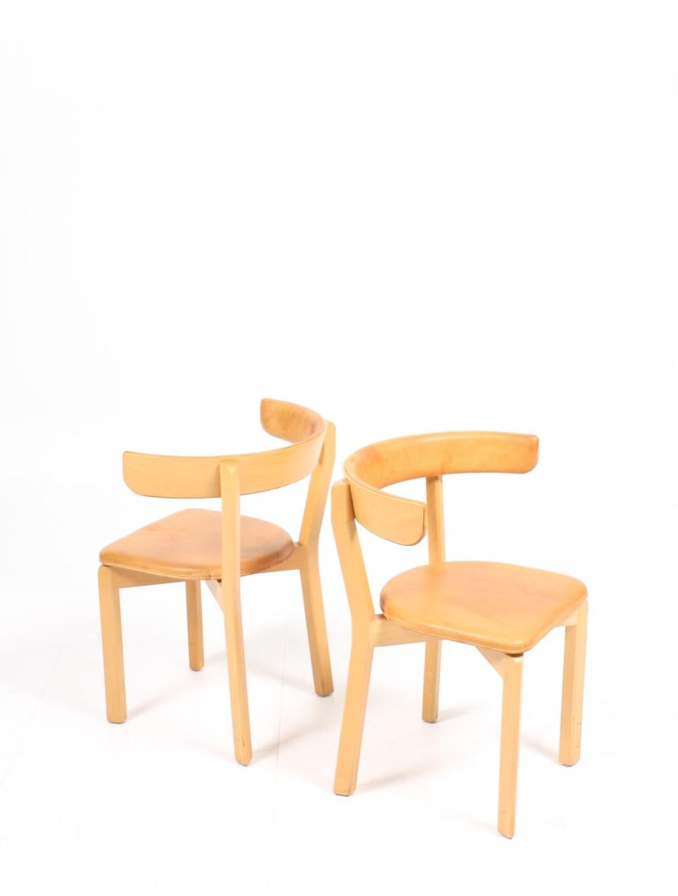Set of eight side chairs covered in patinated leather on a solid beech frame. Designed by MAA. Jørgen Gammelgaard - Made by Sorø Møbelfabrik Denmark in the 1970s. Good original condition.