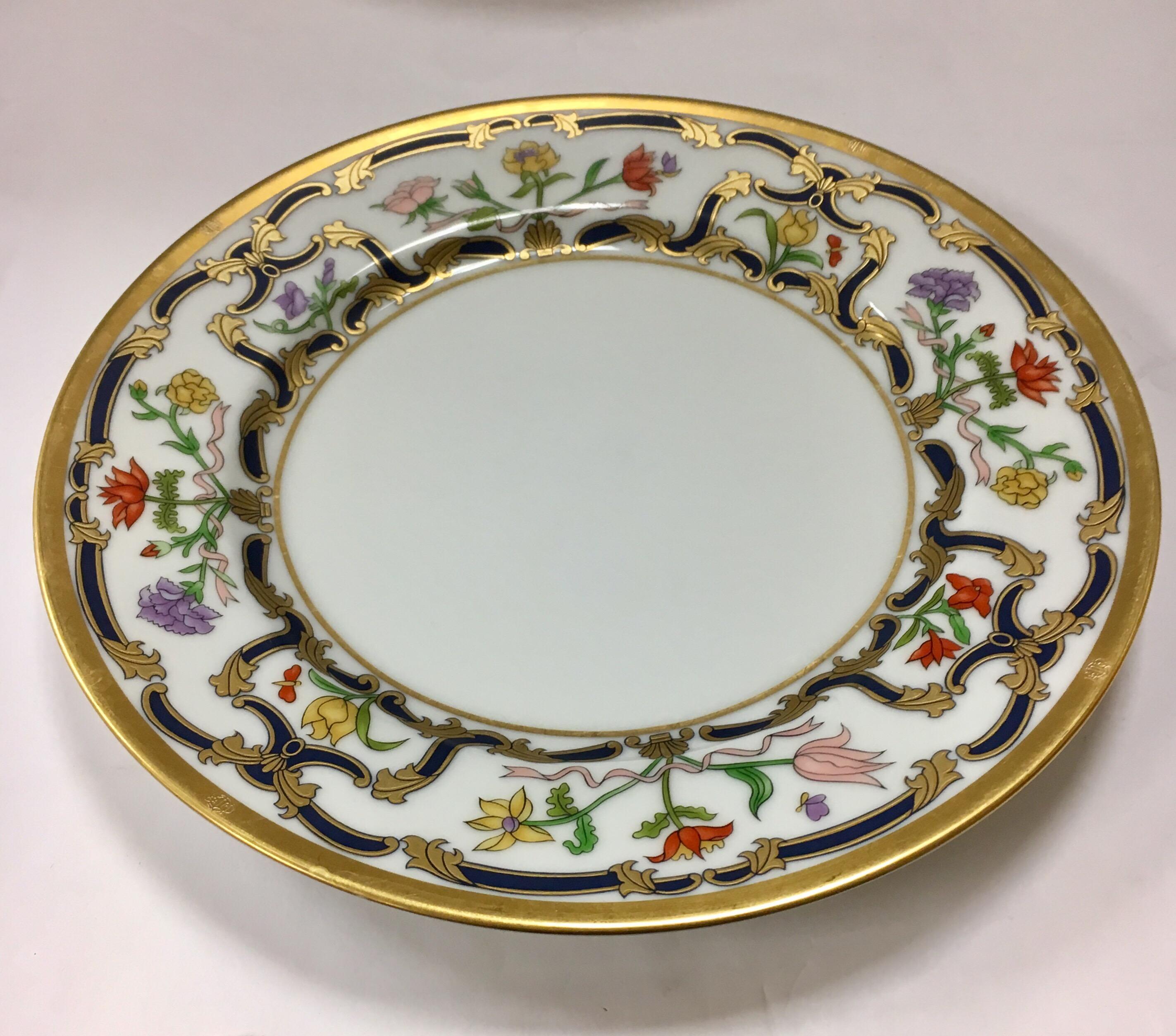 Rare, coveted and out of production Christian Dior fine porcelain china. The pattern is Renaissance and
it features the famed blue and gold scrolls and floral rim. The set was in production from 1990-1999 and then was discontinued, making this