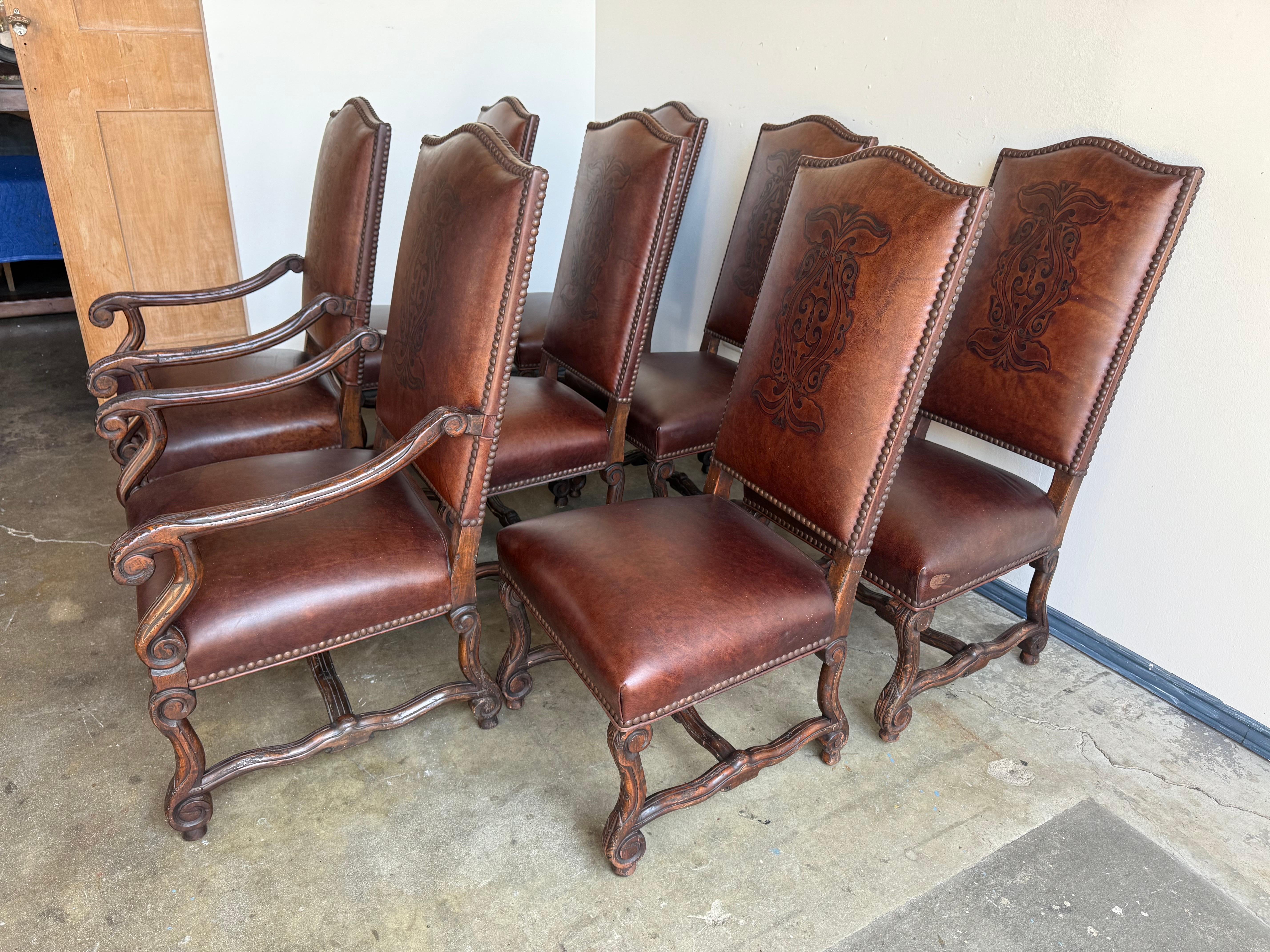 Spanish Colonial Set of Eight Spanish Revival Leather and Carved Walnut Dining Chairs For Sale