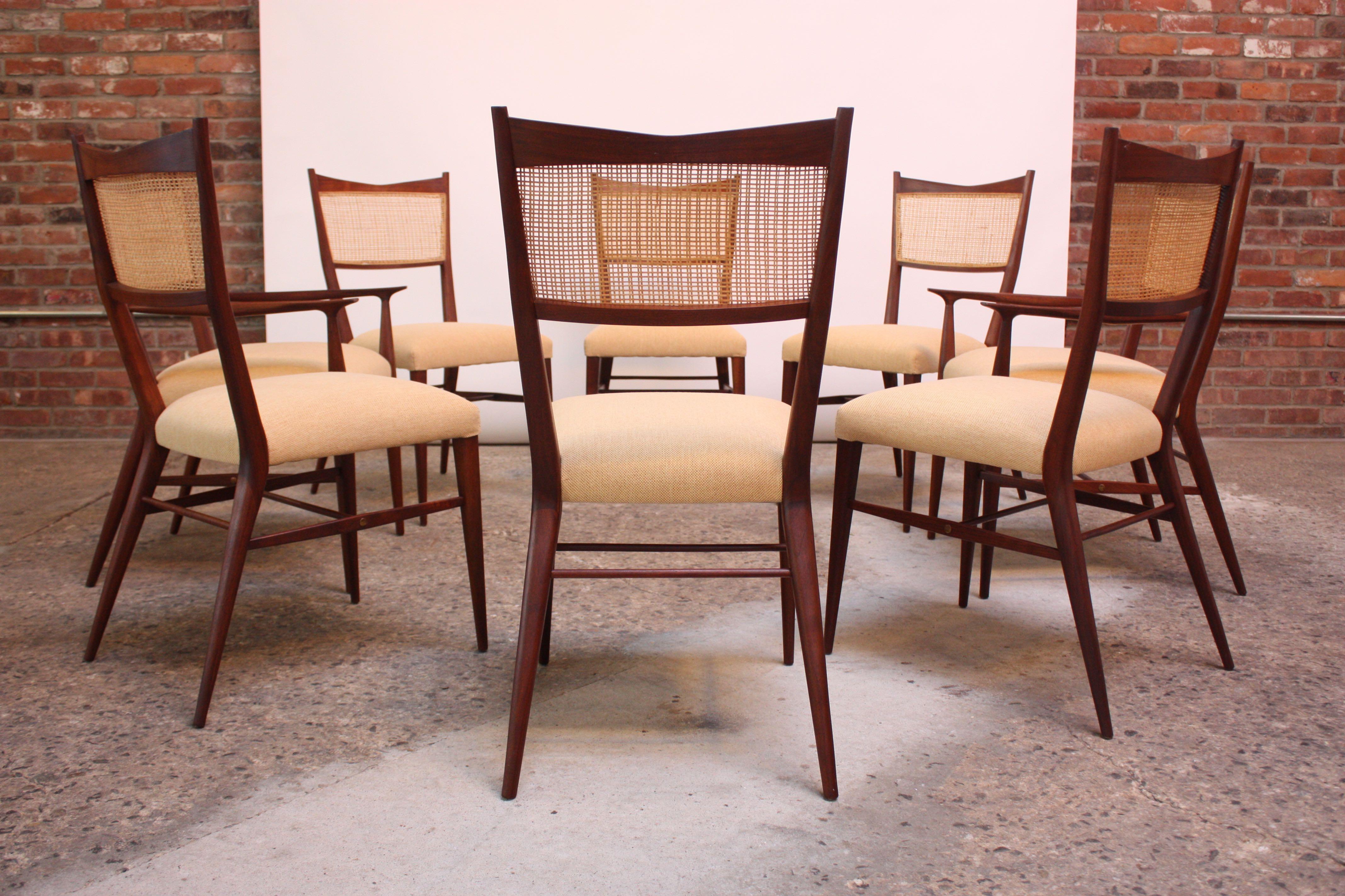 Set of eight (two arm and six side) Paul Mccobb Directional dining chairs produced by H. Sacks & Sons of Boston, MA for their Connoisseur collection in 1956 (model number 7001 side chairs and 7009 arm chairs). Stained mahogany sculptural frames with