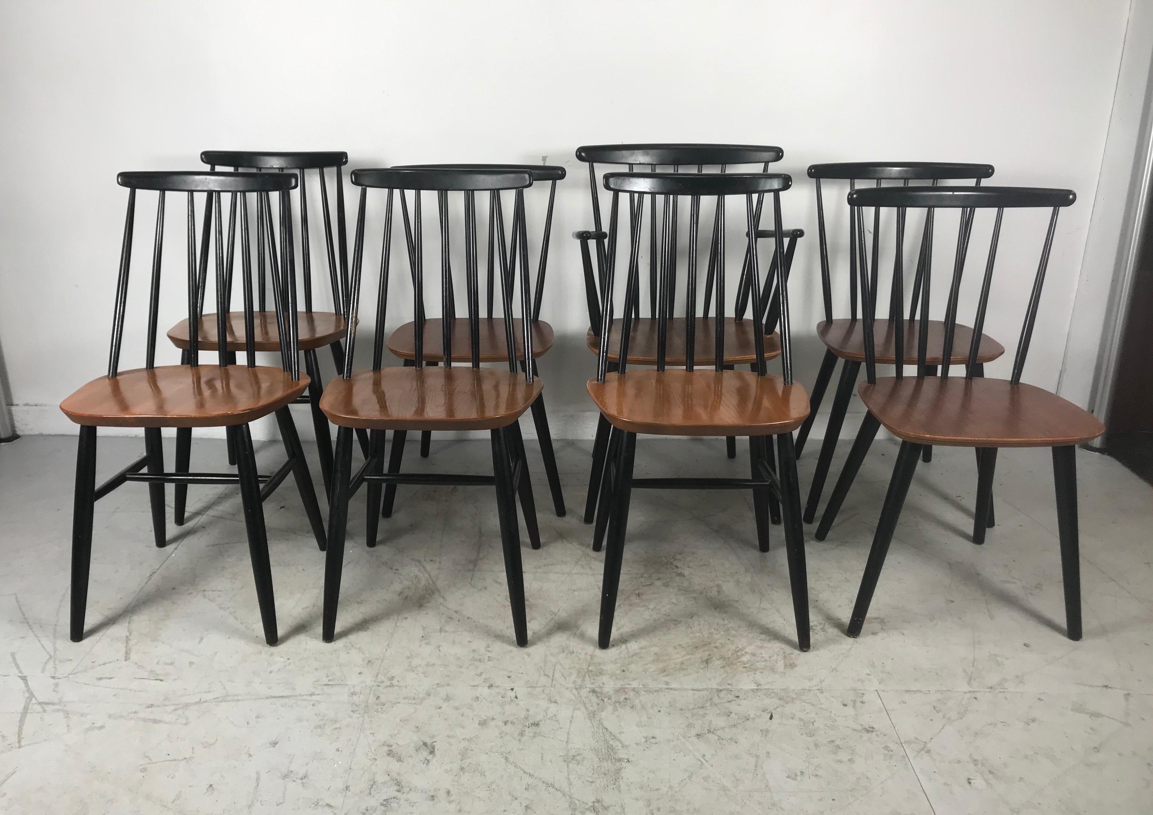 Set of eight stick back Scandinavian dining chairs by Thomas Harlev for Farstrup. Made in Denmark. Stained beechwood and ply. Set consists of seven side chairs and one arm chair. Quality, sturdy construction, retain original finish, minor scuffing,