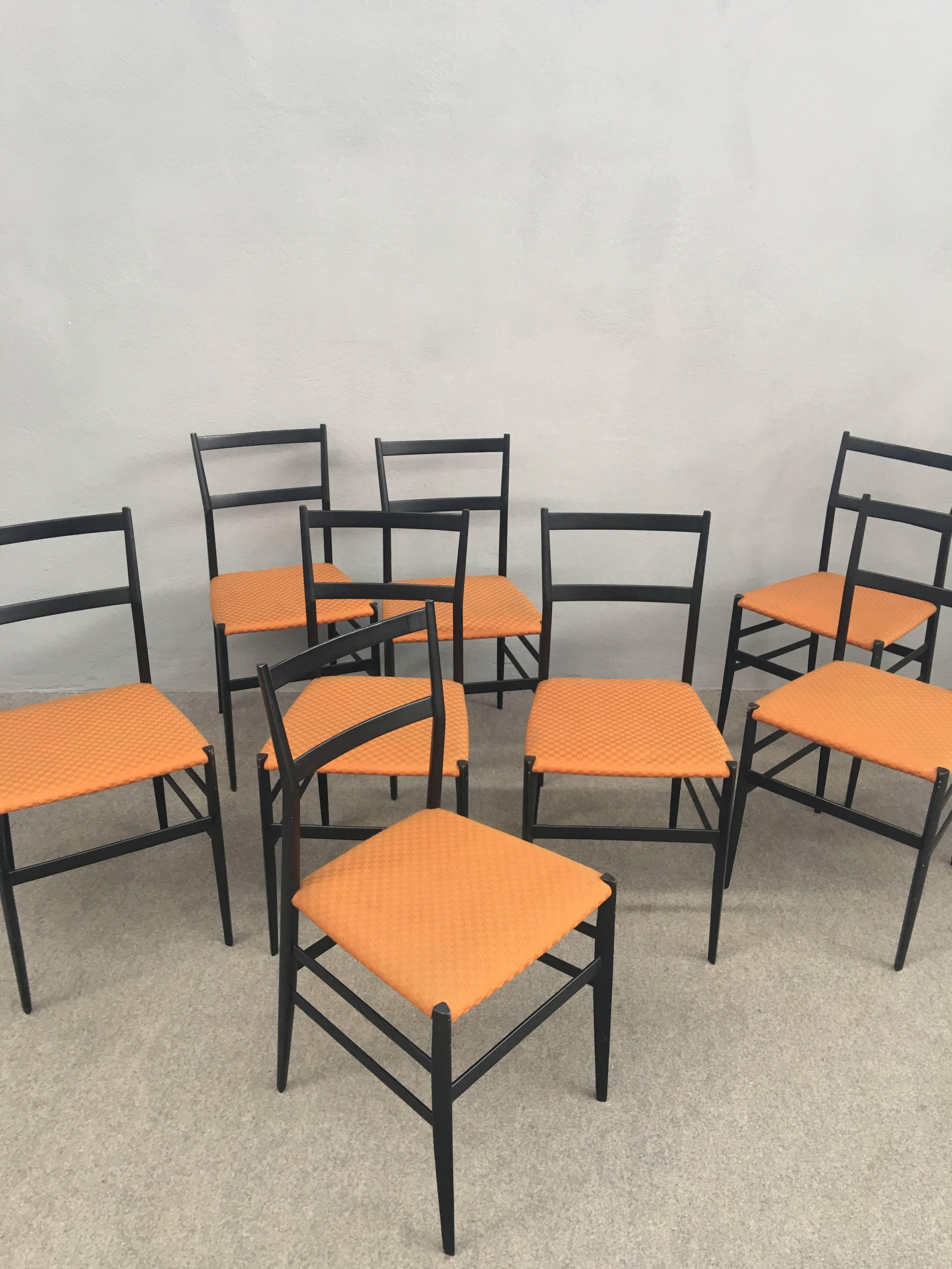 Iconic set of eight seperleggera chairs, early edition.
Label Figli di Amedeo Cassina. Original fabric.
