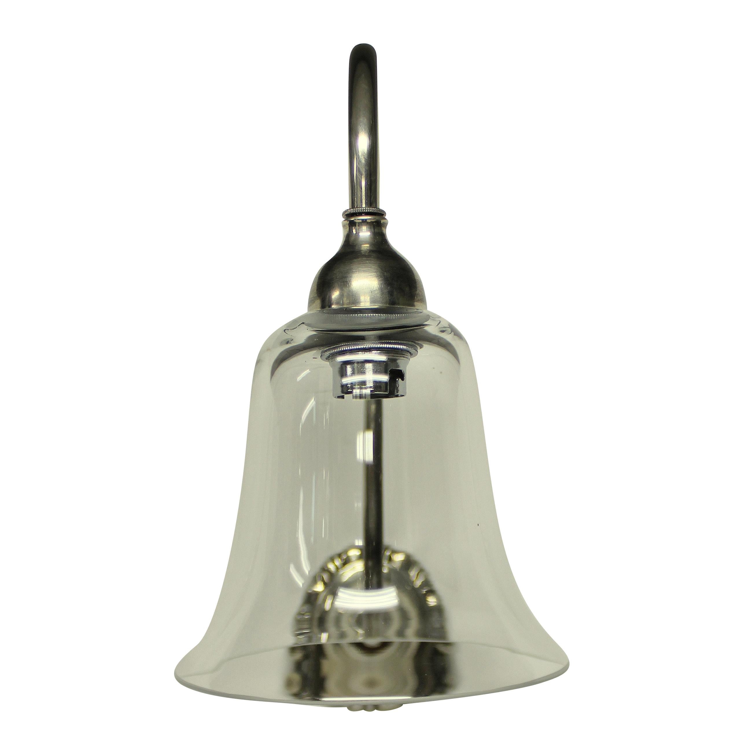A set of eight English swan neck wall lights in silver plated brass, each with a bell shaped glass shade.