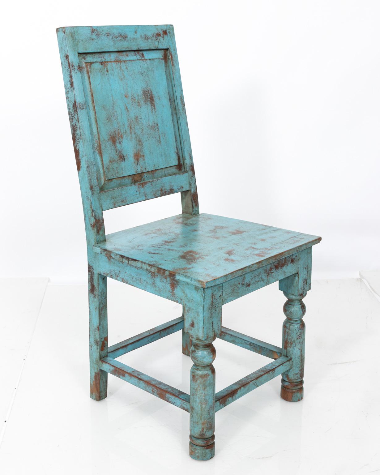 Set of eight Swedish style blue painted chairs with square backs. Please note of wear due to age and daily use including cracks on the seats and backs.
