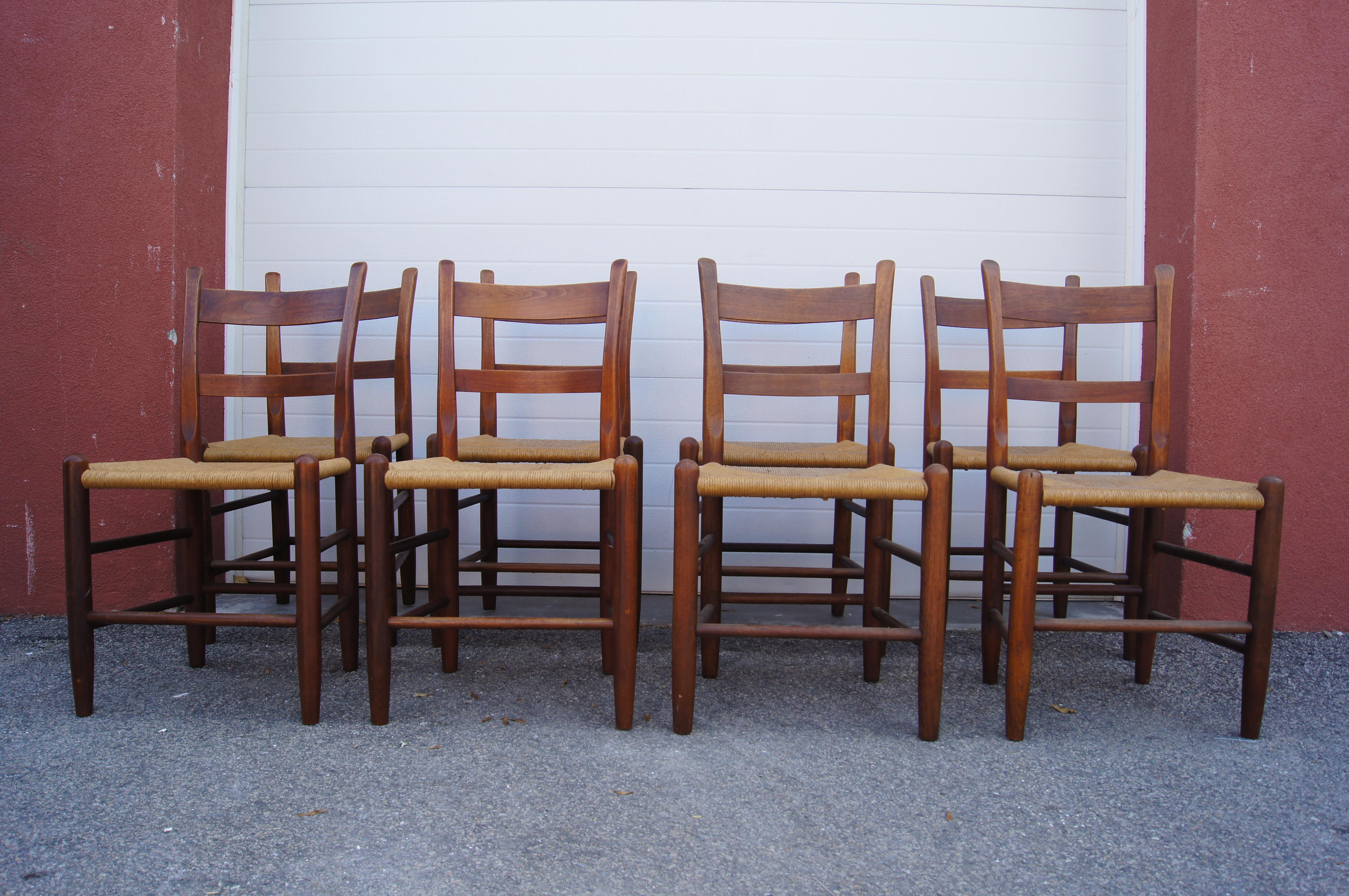 This set of eight dining chairs by the Cambridge, Massachusetts, furniture maker Charles Webb features solid teak frames with angled backs and rush seats. 



 