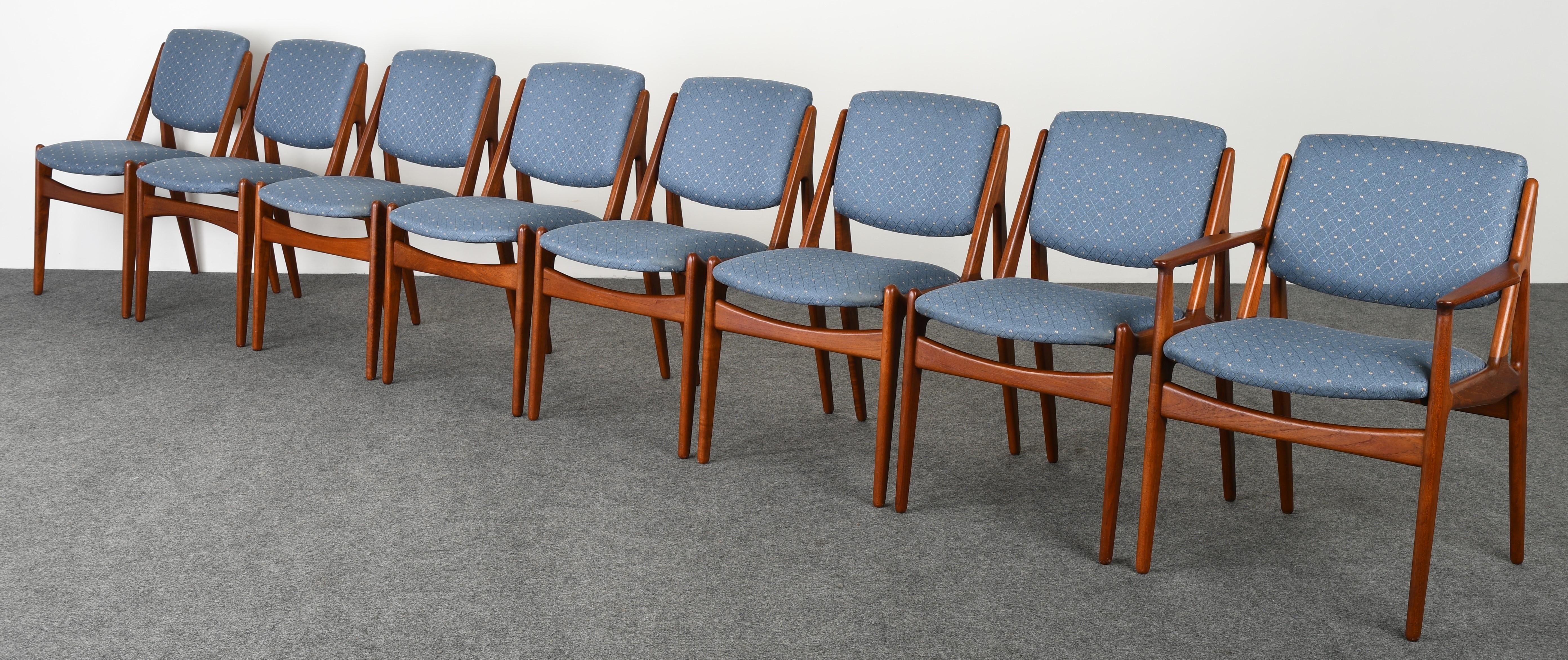 A set of eight sleek Mid-Century Modern dining chairs designed by Arne Vodder. This Danish Modern set of chairs includes seven side chairs and one armchair. The chairs are structurally sound and are in good condition. New upholstery suggested but