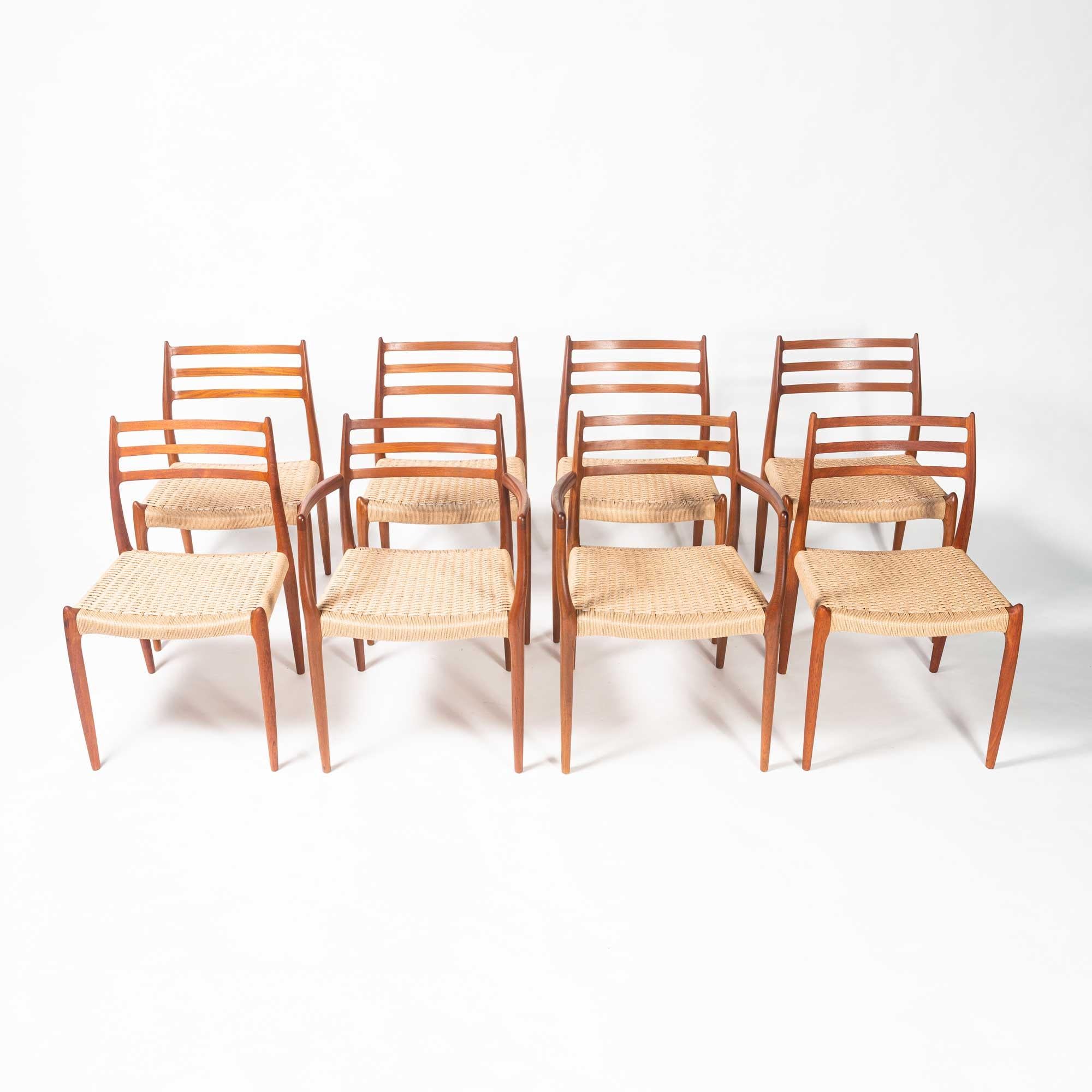 Iconic set of 6 teak dining chairs designed by Niels Otto Moller for JL Møller Møbelfabrikin 1954. The set comprises of six model #78 chairs and two model #62 carver armchairs. The set has been completely restored, with all new natural paper-cord.