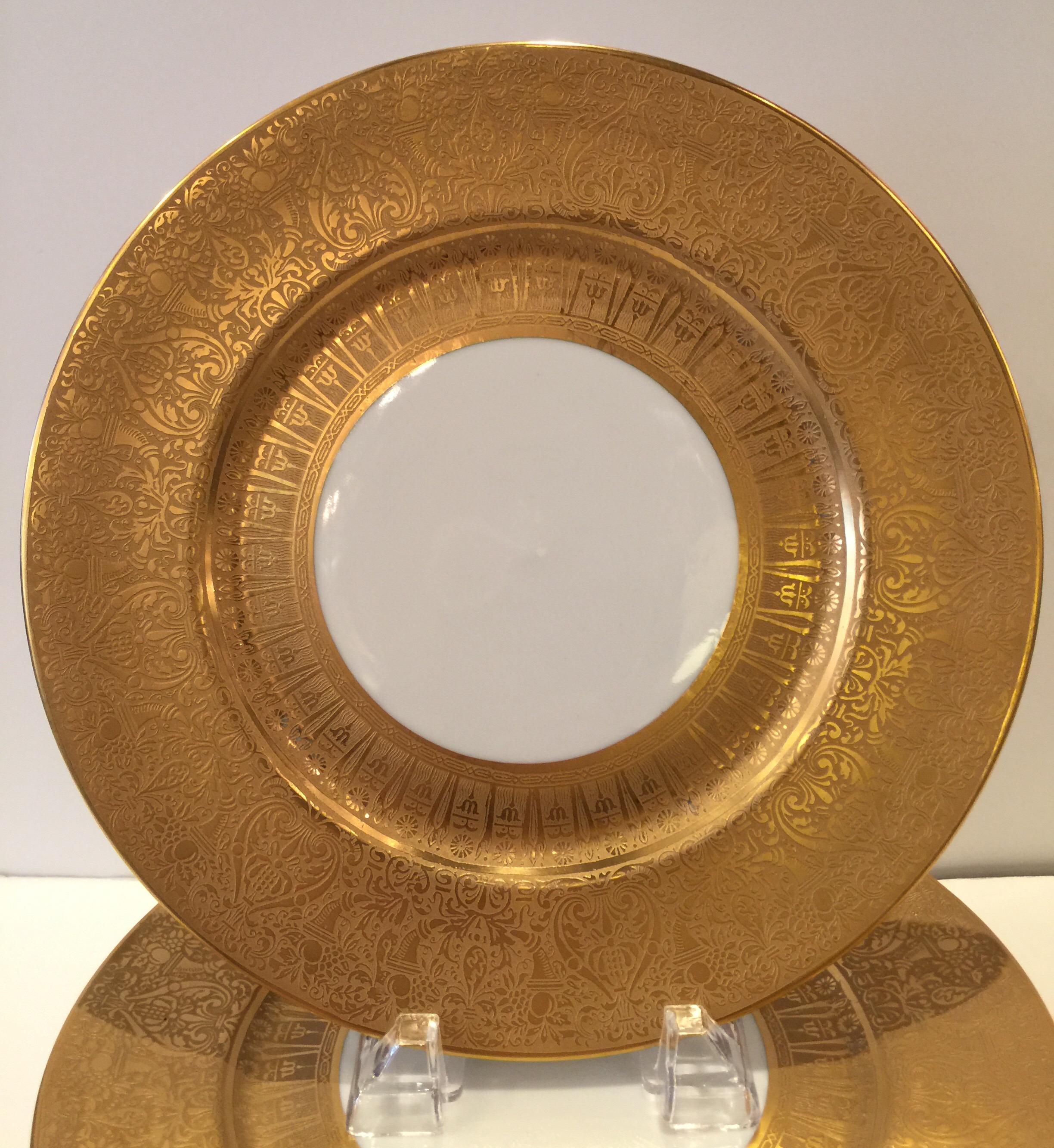 Set of eight thick gold embossed dinner/service plates Heinrich & Co., Bavaria.