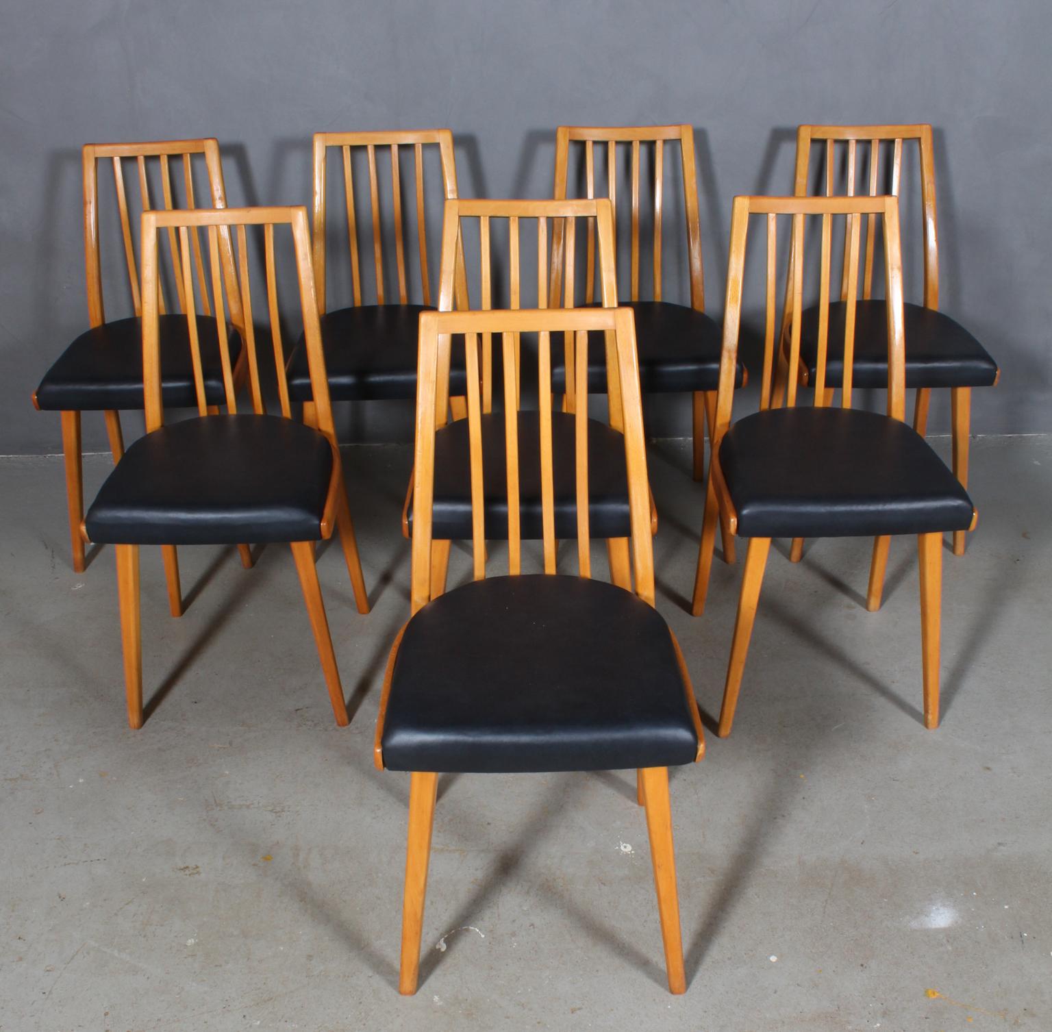 Set of eight Thonet (Ton) dining chairs new upholstered with black aniline leather.

Frame of solid beech.

Made in the 1940s by Thonet (Ton).