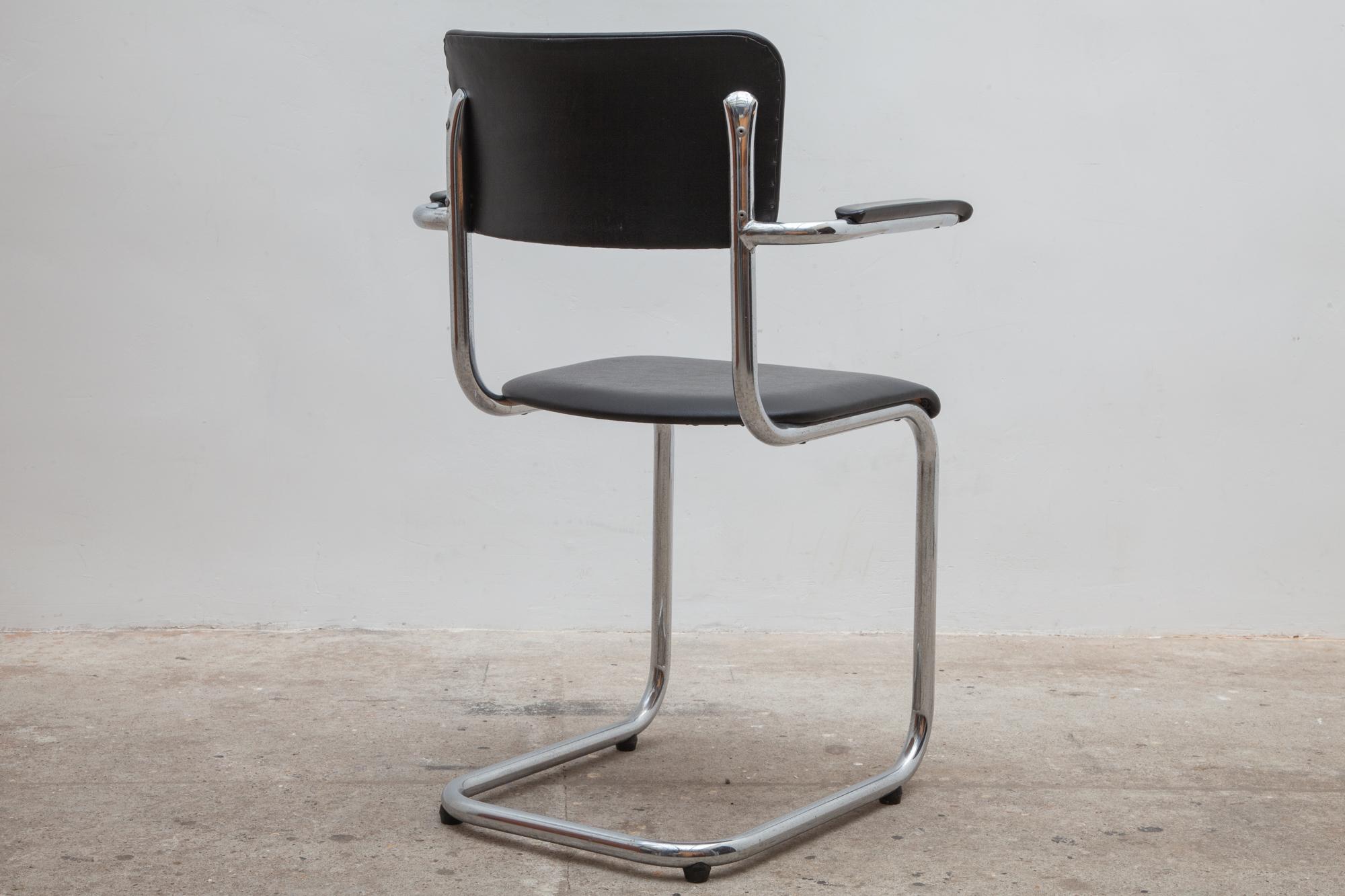 Four chairs by Tubax, Belgium. Bent chrome frames with bakelite armrests. Black vinyl upholstery in excellent condition.

Dimensions: 55 W x 84 H x 42 D cm - Seat: 45 cm high.8 pieces.