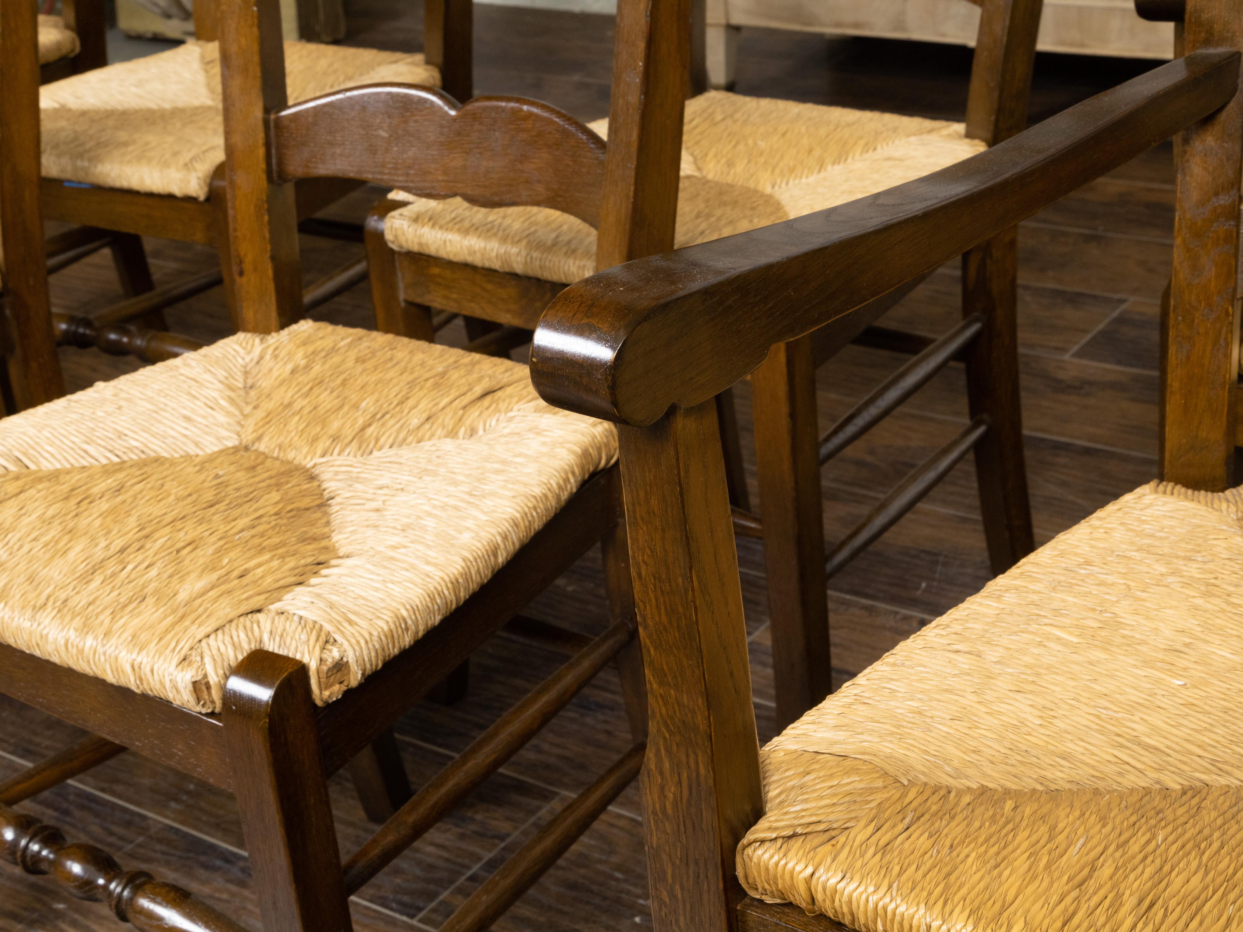 Set of Eight Turn of the Century Oak Ladderback Dining Chairs with Rush Seats For Sale 1
