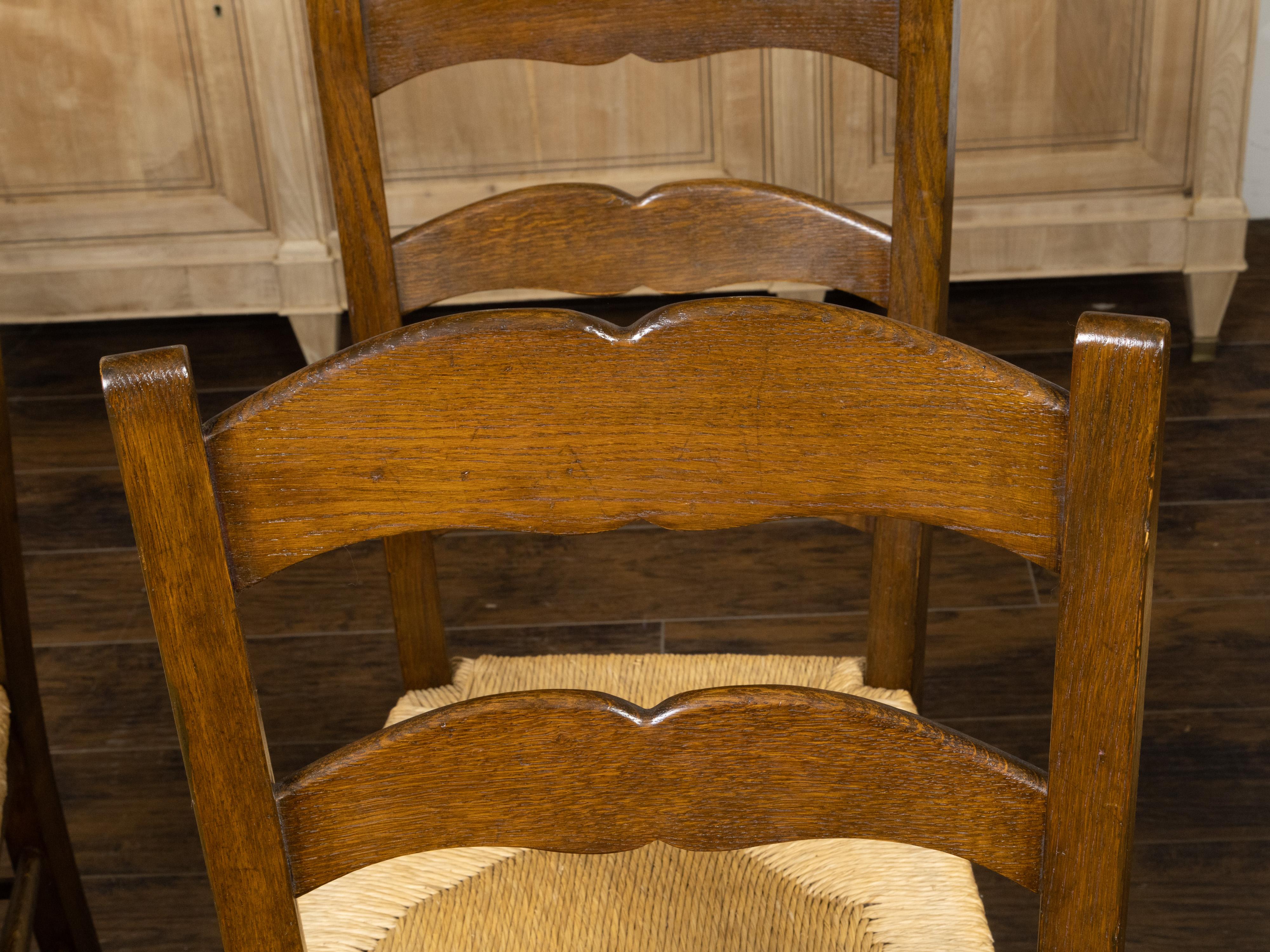 Set of Eight Turn of the Century Oak Ladderback Dining Chairs with Rush Seats For Sale 3