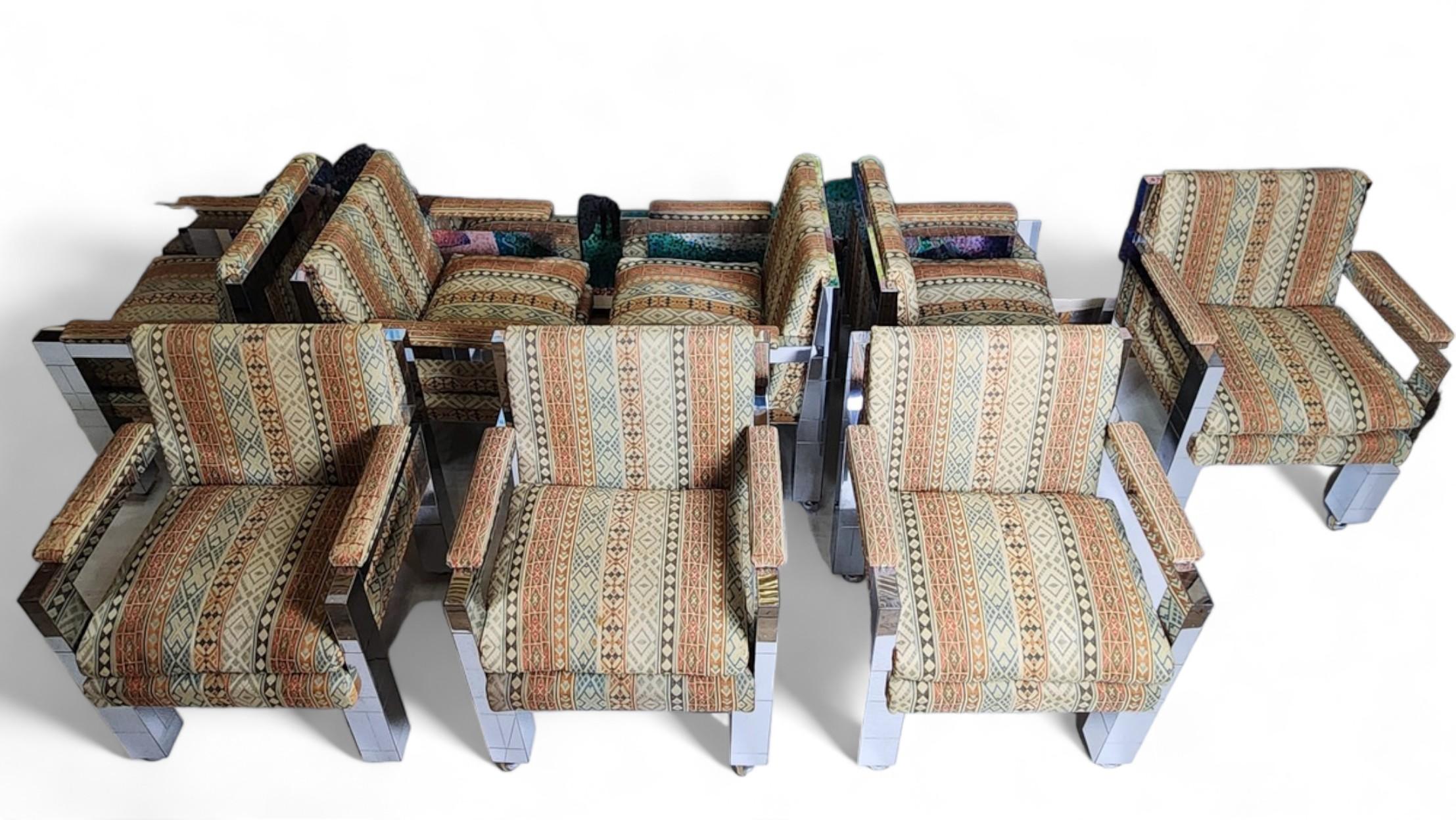 An original 60 year old set of eight unique chrome armchairs on coasters by Paul Evans produced at the Paul Evans Studio designed as part of an extensive commission for the home of personal friends.
The upholstery is original as pictured in the