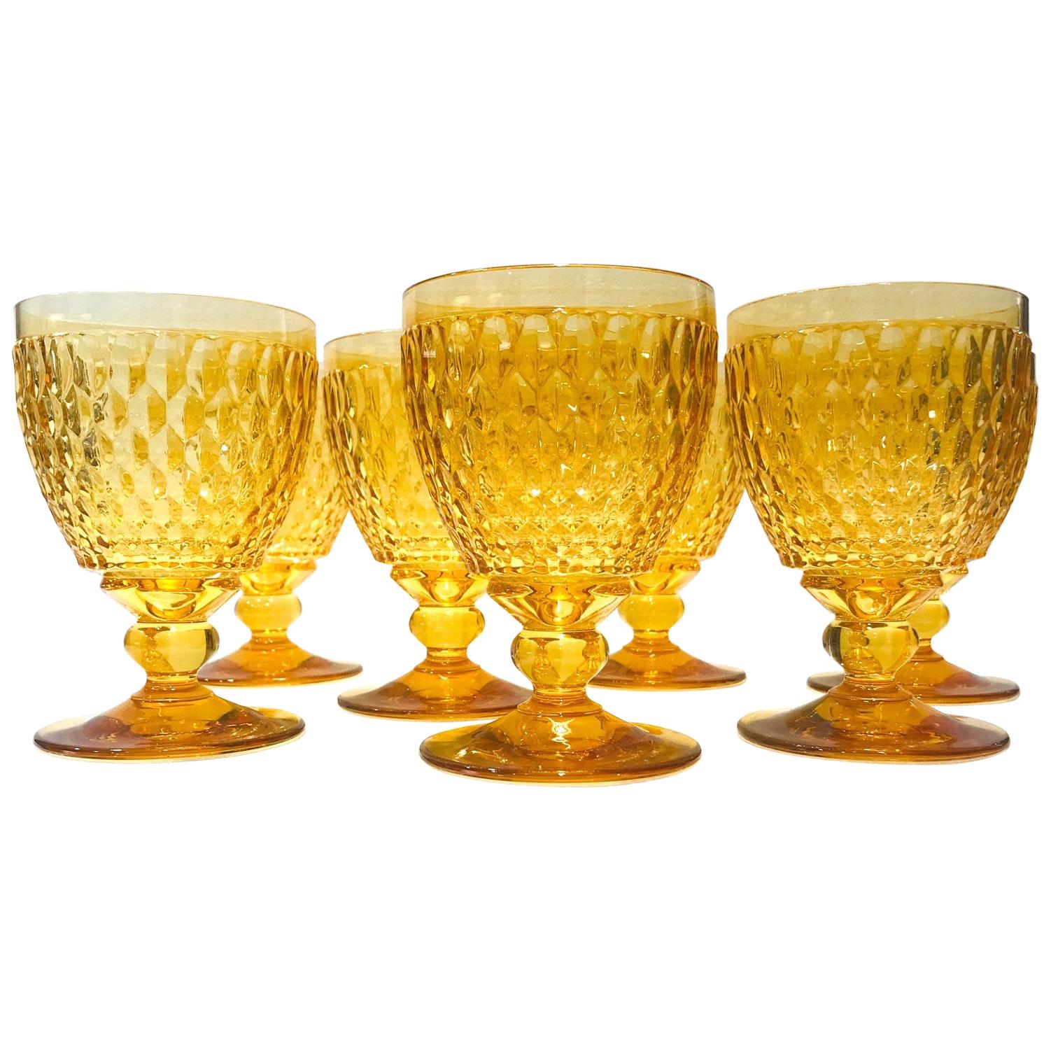 Set of eight German crystal goblets from Villeroy & Boch. Stemware glasses feature hobnail crystal with a classic diamond pattern. The glasses are designed with deliberate short stems with a blown glass ball accent. Available in gorgeous amber or