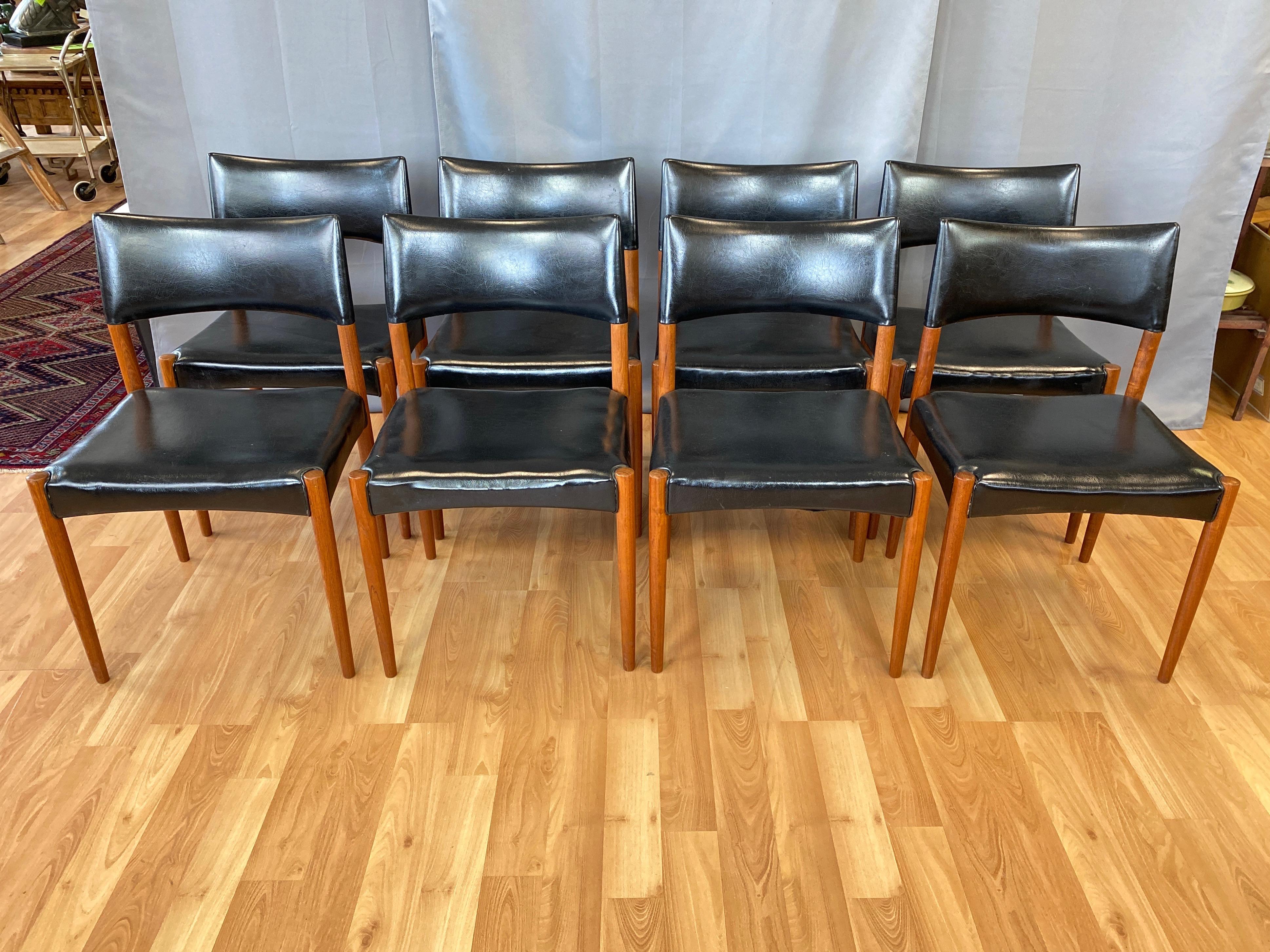 A very handsome 1960s eight-piece set of Villy Schou Andersen model 60 teak dining chairs with black faux leather upholstery.

Classic and clean Danish modern design distinguished by uniformly tapered solid teak legs and subtly arched lines of seat