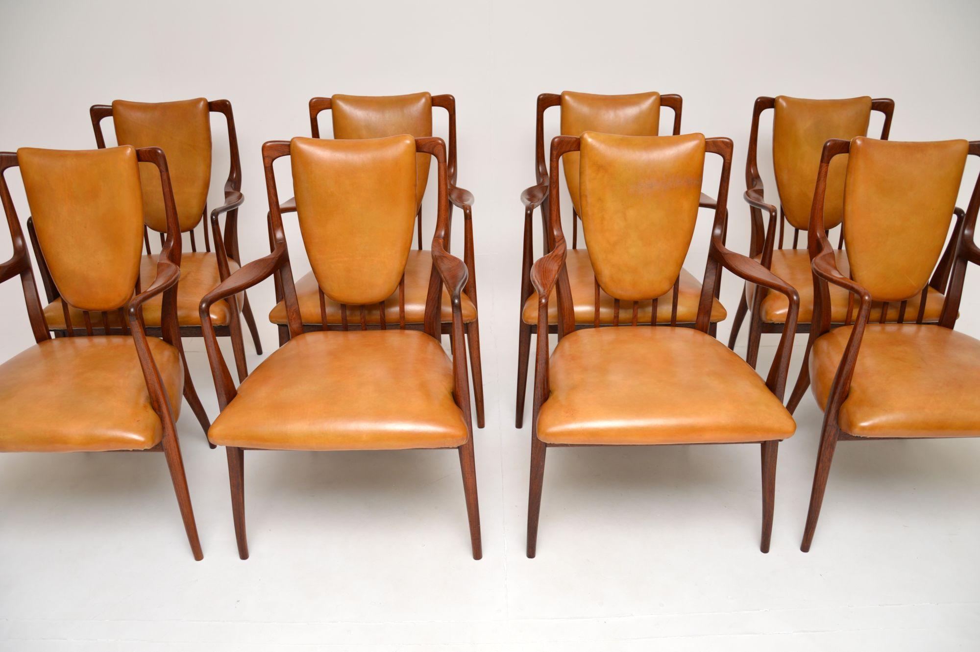 A spectacular and very rare set of eight vintage dining chairs by A.J Milne. They were made in England and retailed by Heals in the 1950’s.

They are of amazing quality, and have an incredibly beautiful design, with stunning organic curves. They