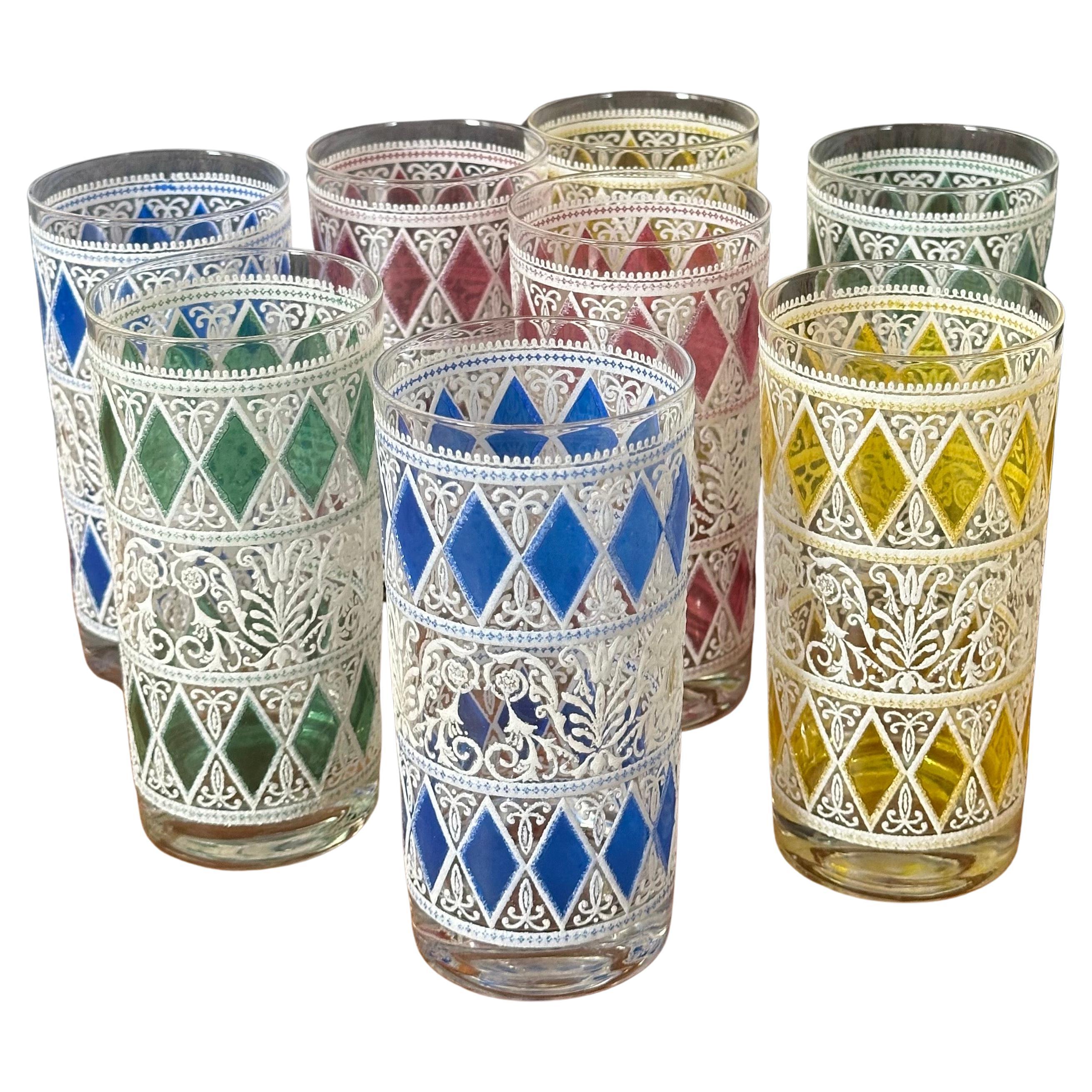 Great set of eight vintage enamelware high ball glasses, circa 1950s.  These glasses are very difficult to find in a set and are in very good condition with no cracks or chips and crisp enamel design.  Each glass stands approximately 5.625