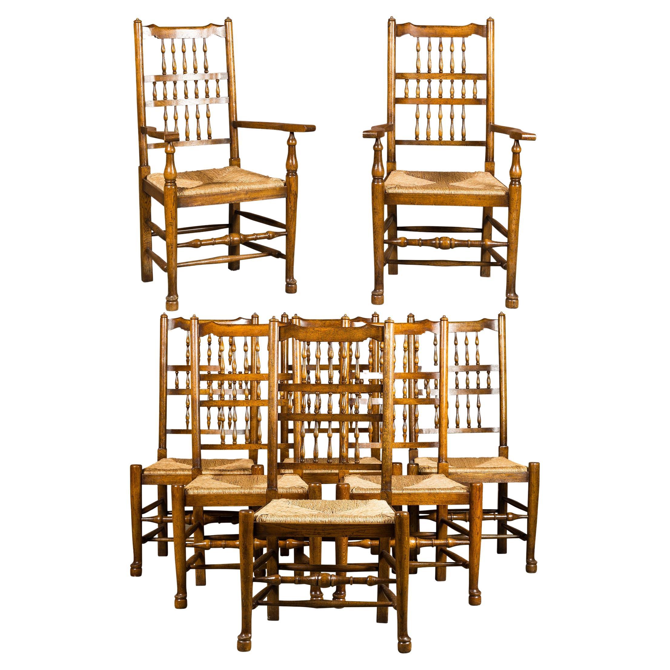 Set of Eight Vintage English Oak Dining Room Chairs with Rush Seats For Sale