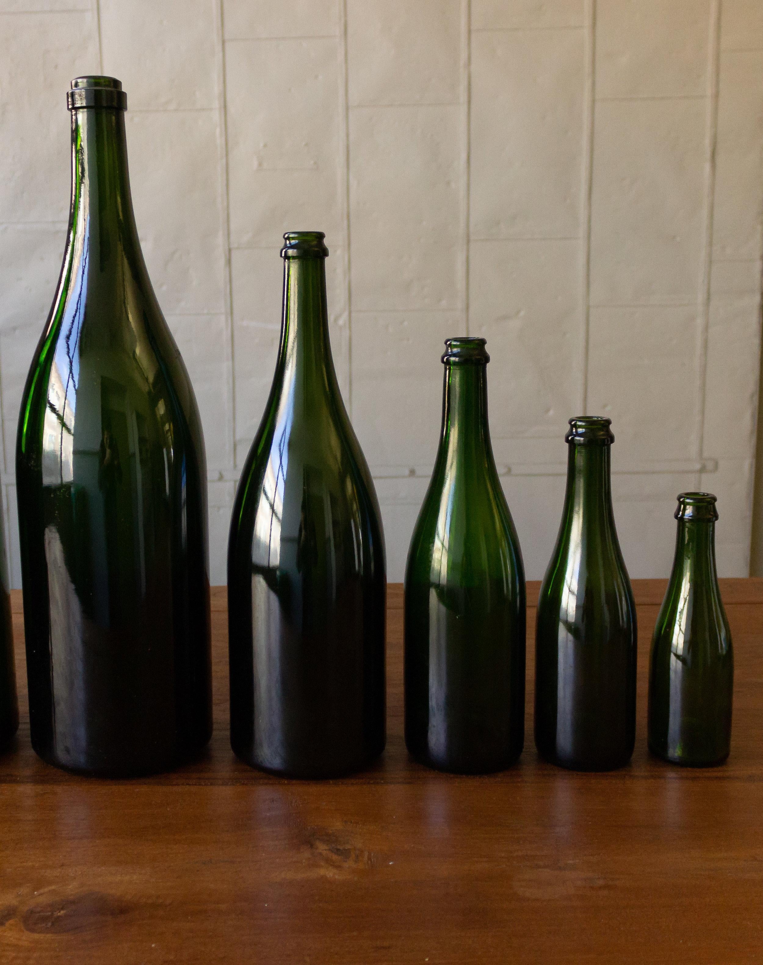 20th Century Set of Eight Vintage French Champagne Bottles For Sale