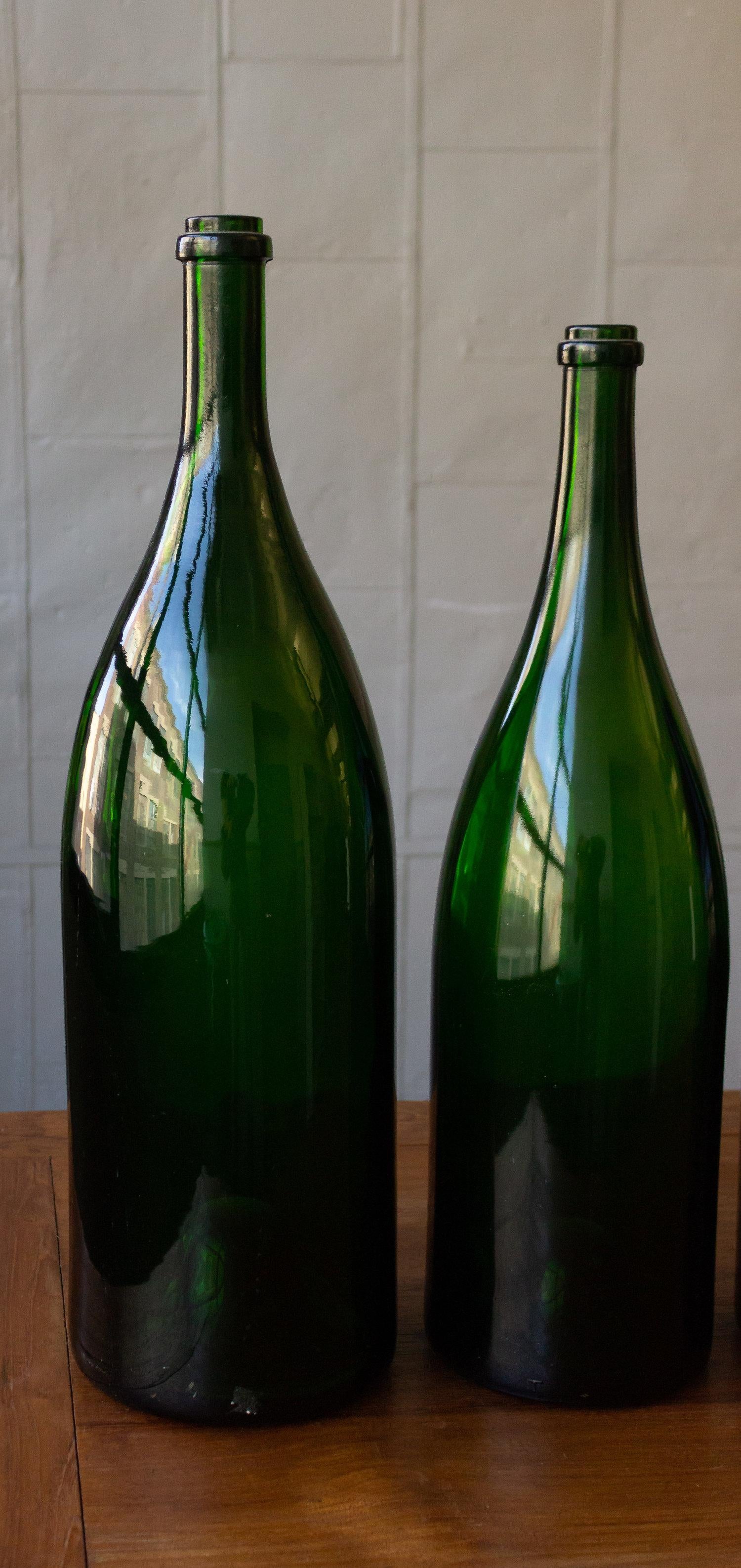 Glass Set of Eight Vintage French Champagne Bottles For Sale