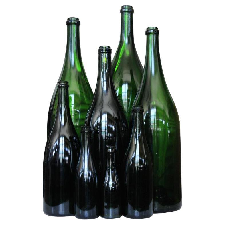Set of Eight Vintage French Champagne Bottles For Sale