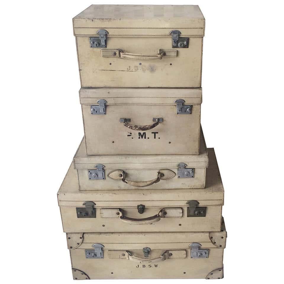 Beautiful set of eight (8) vintage luggage in various materials:

Qty one (1): 1930s metal suitcase by Jones Brothers & Co. combination of wood and metal with unique hardware. Dimensions: Height 8 in. (20.32 cm), width 24 in. (60.96 cm), depth 15