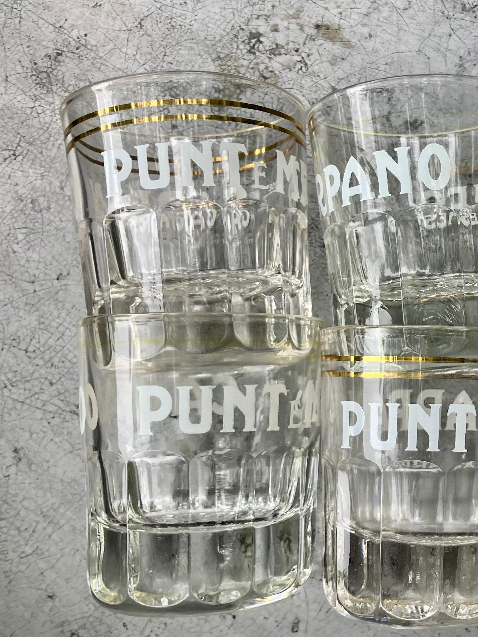 Set of eight vintage shot glasses. Eight midcentury Carpano Punt E Mes fluted base glasses with gilded banding in various states of wear to gilding but otherwise in perfect condition. Italy, 20th century.
Dimensions: 2.5